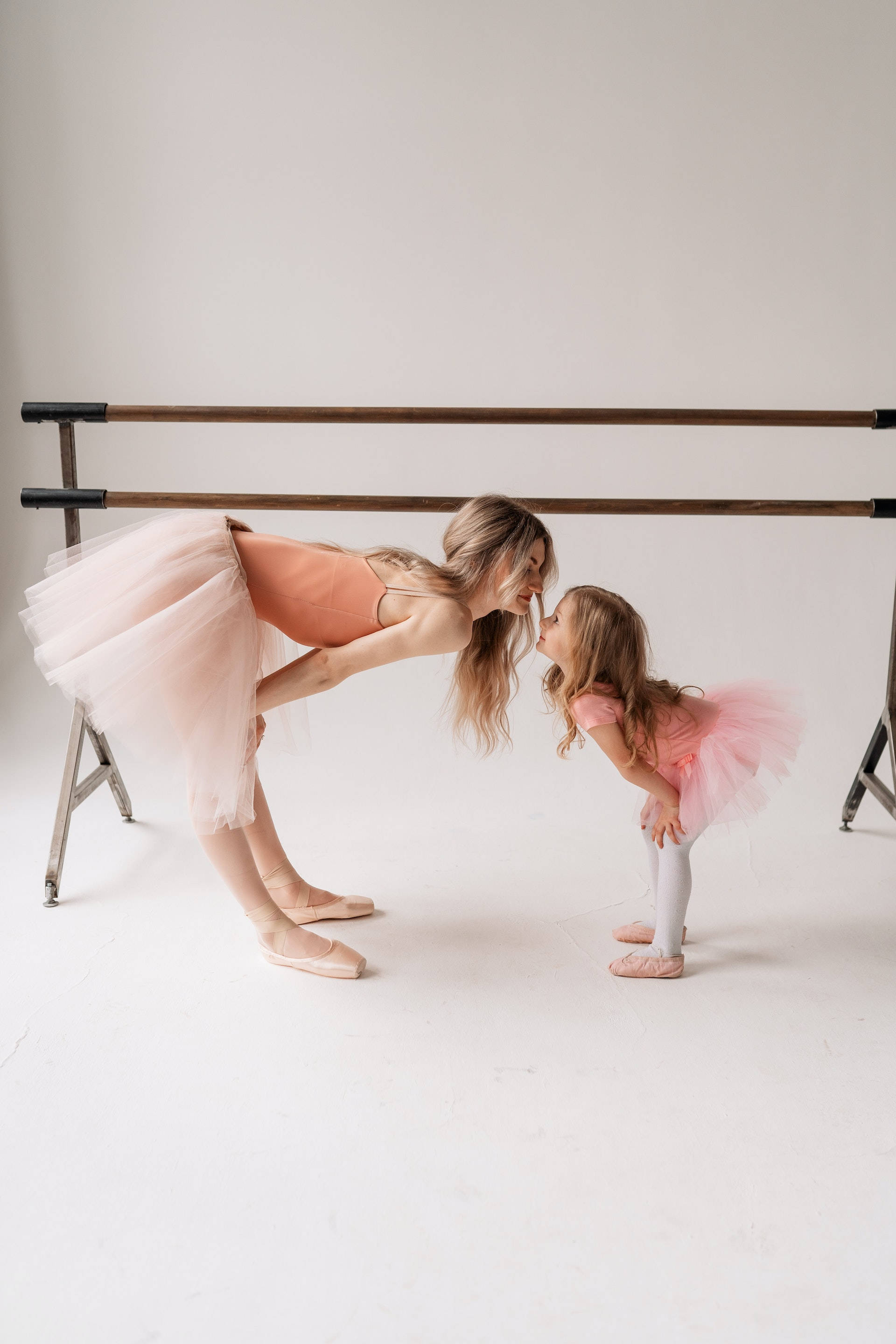 pink tutus, ballet barre, minimalist studio, 2K Phone Wallpaper
