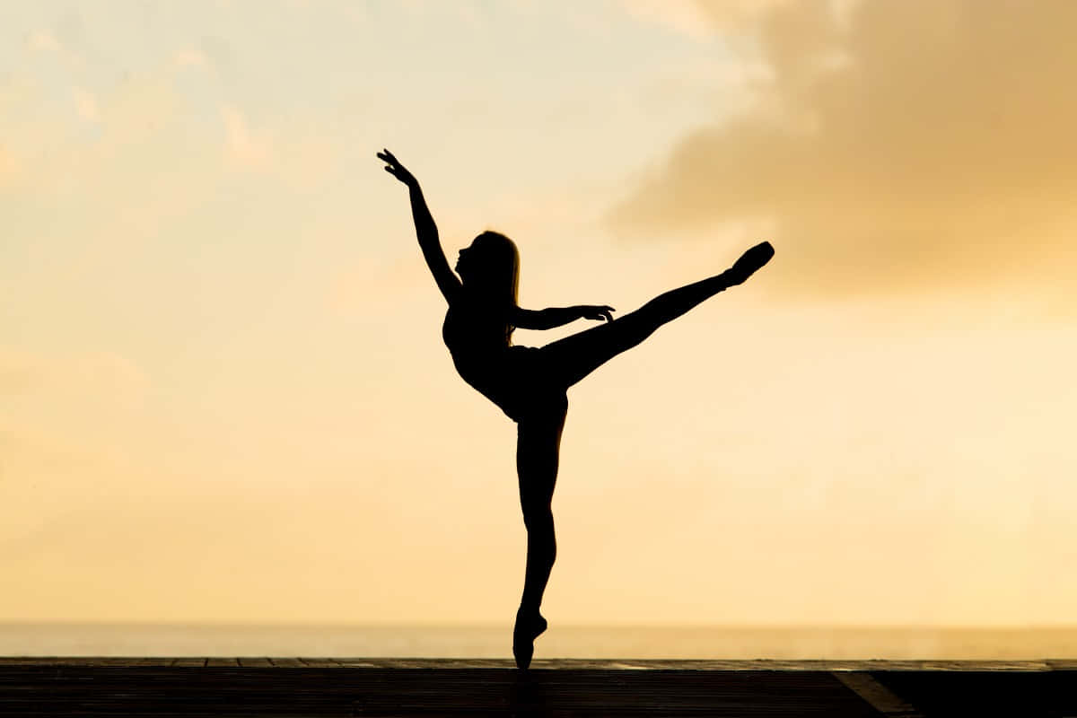 ballerina dancer, arabesque pose, warm golden sunset sky, SD Desktop Wallpaper