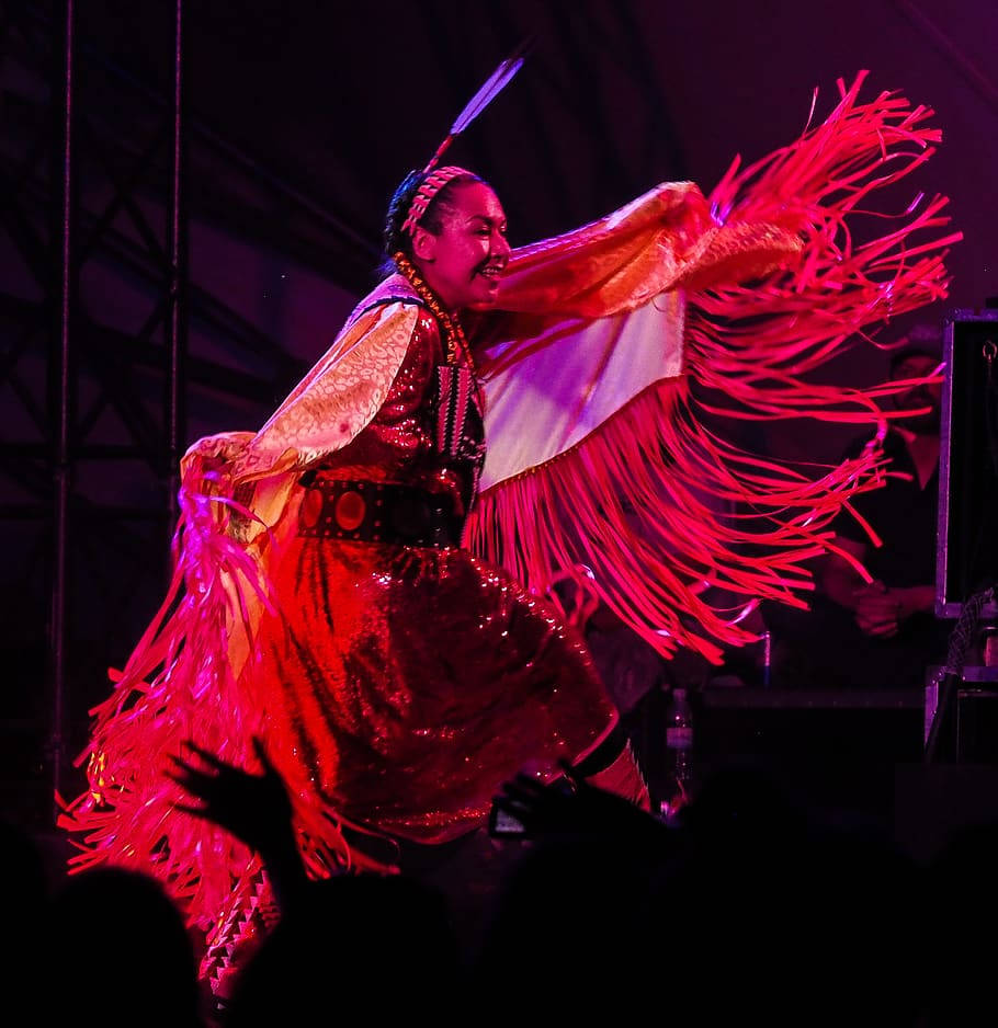 Navajo woman, traditional dance pose, vibrant red fringed attire, SD Phone Wallpaper