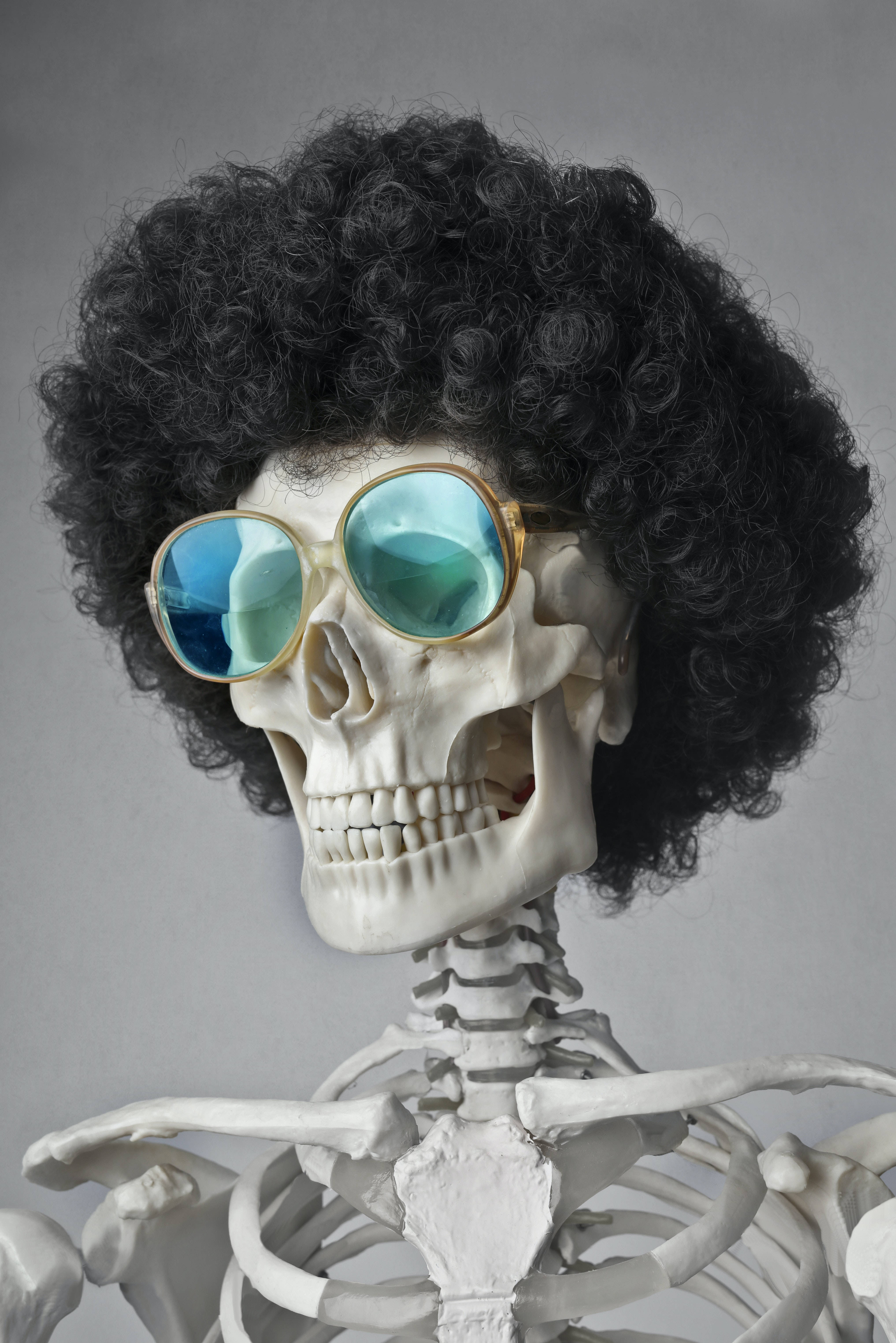 funky skeleton, black afro wig, oversized blue-tinted sunglasses, 5K Phone Wallpaper