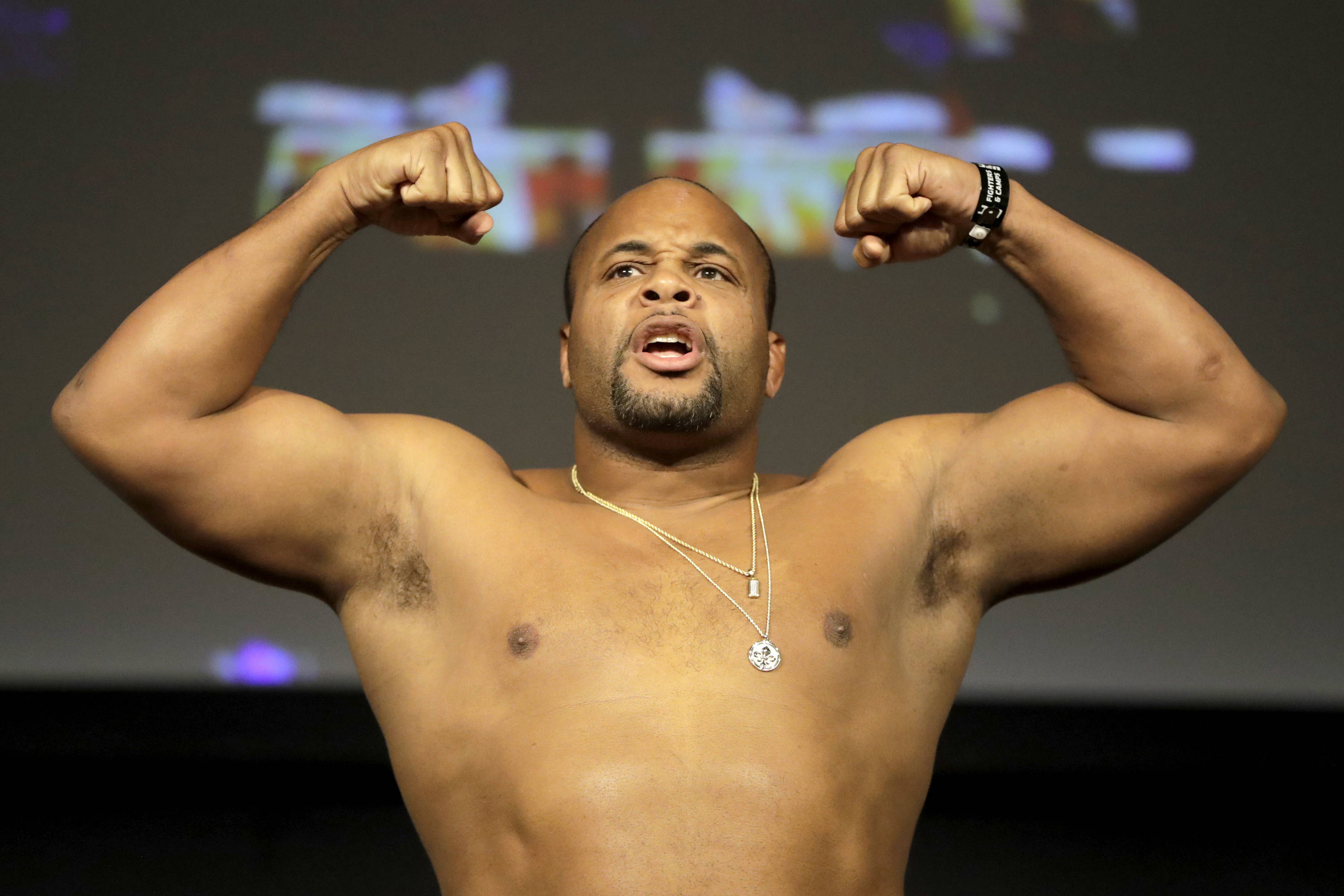 Daniel Cormier, muscular man, dark stage backdrop, 2K Desktop Wallpaper