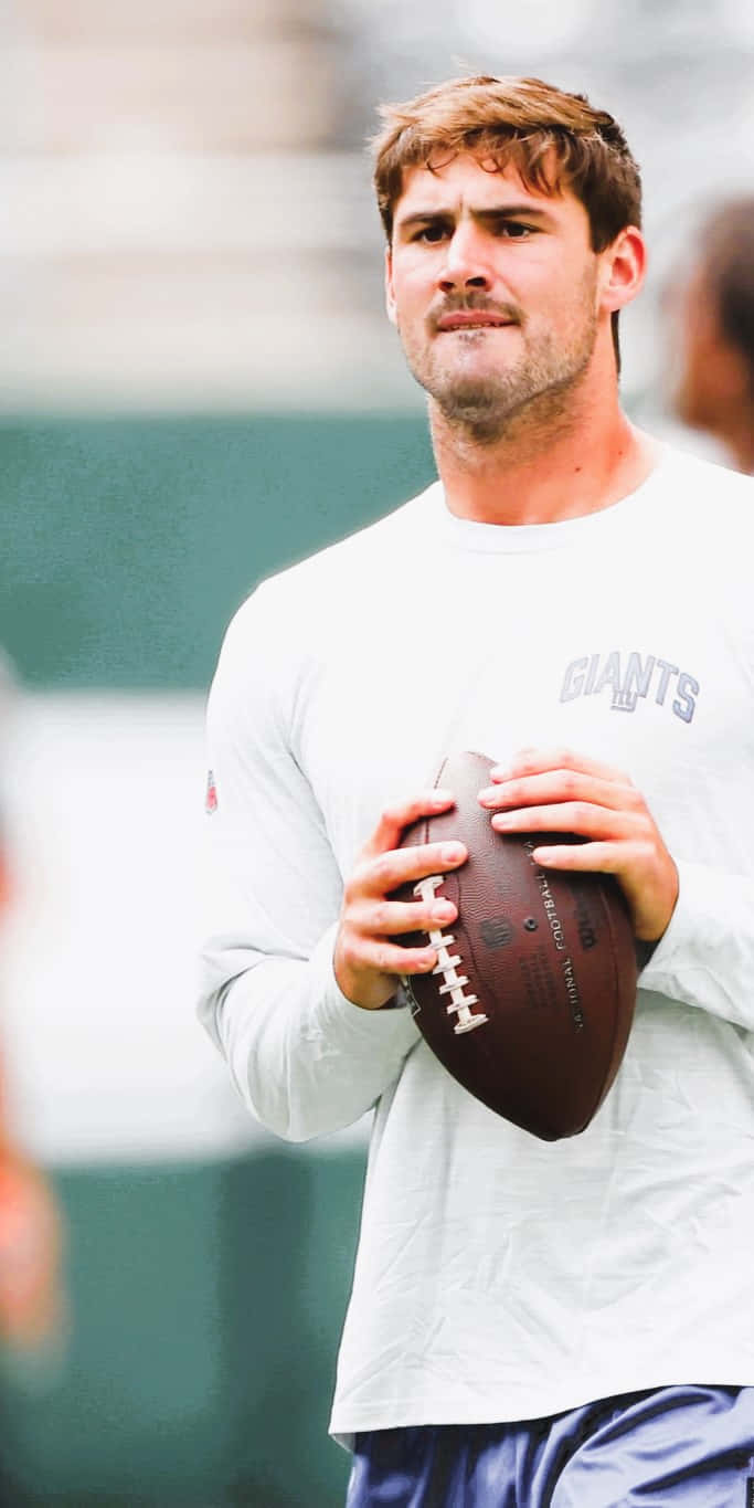 Daniel Jones, Giants practice jersey, brown leather football, HD Phone Wallpaper