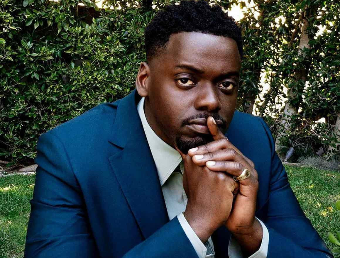Daniel Kaluuya, blue suit, lush green hedge, SD Desktop Wallpaper