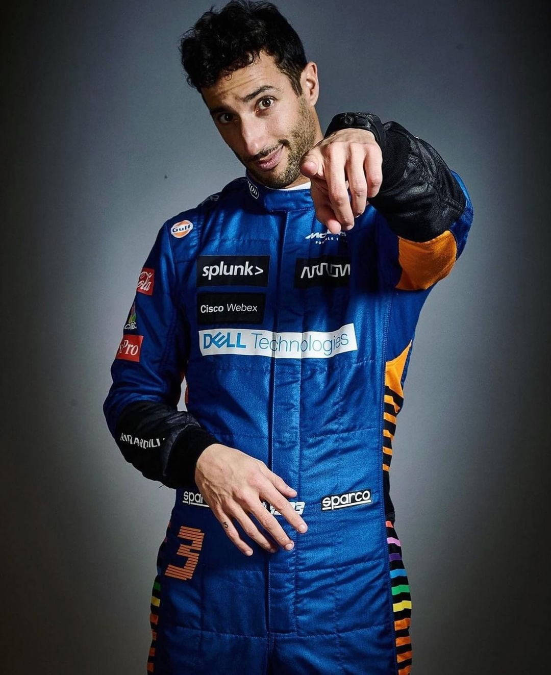 Daniel Ricciardo, blue sponsor-covered suit, dark studio backdrop, HD Phone Wallpaper