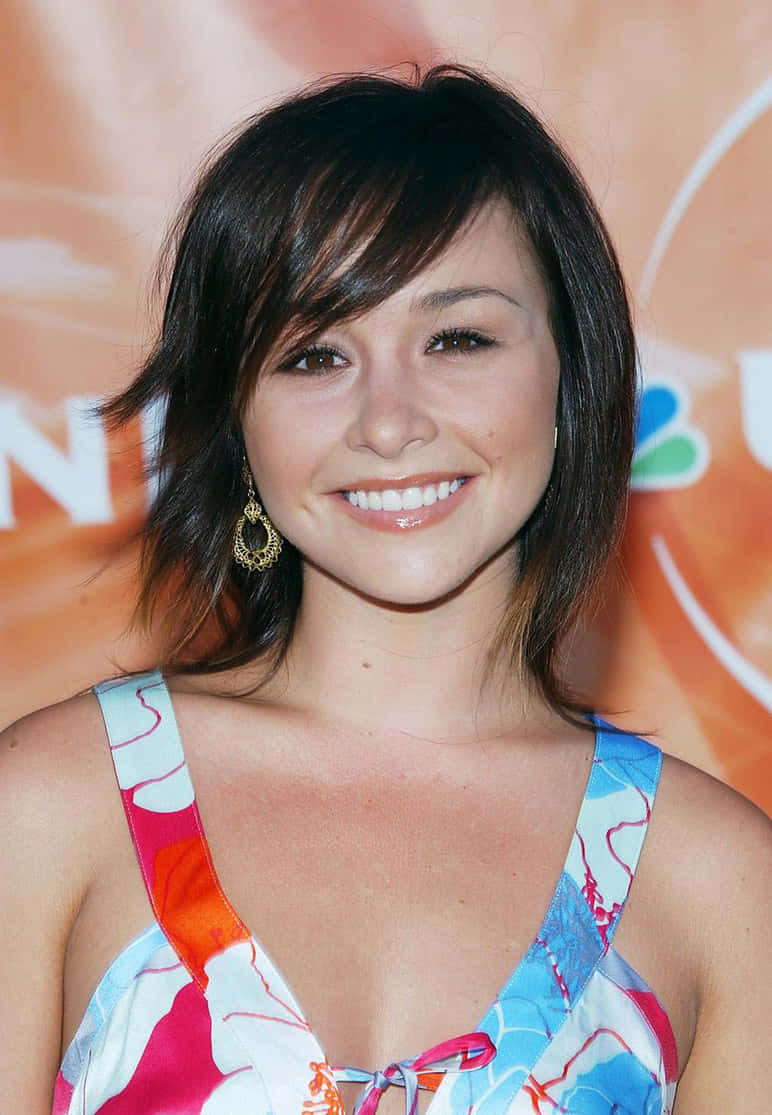 Danielle Harris, red carpet, bright orange NBC backdrop, SD Phone Wallpaper
