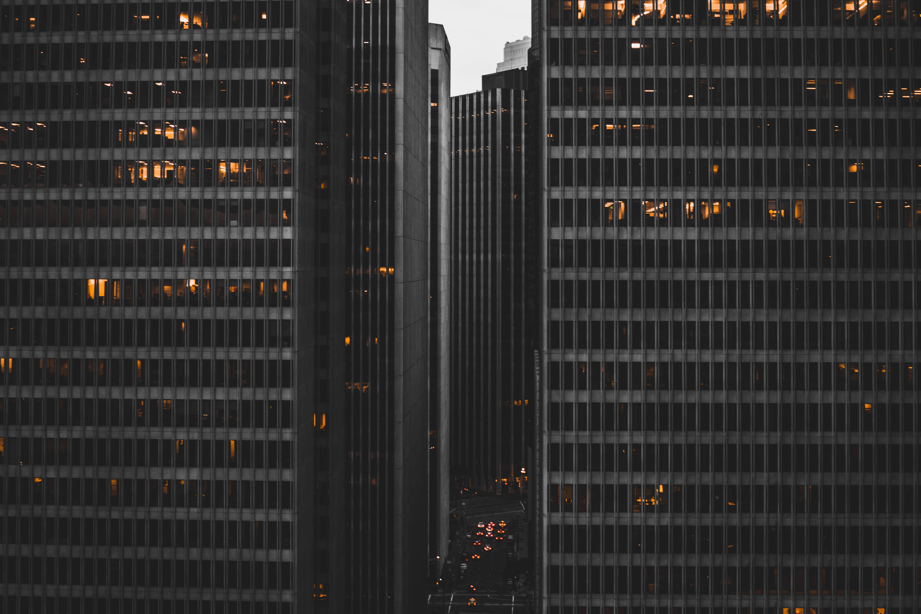 high rise building, dusk, glowing windows, 2K Desktop Wallpaper