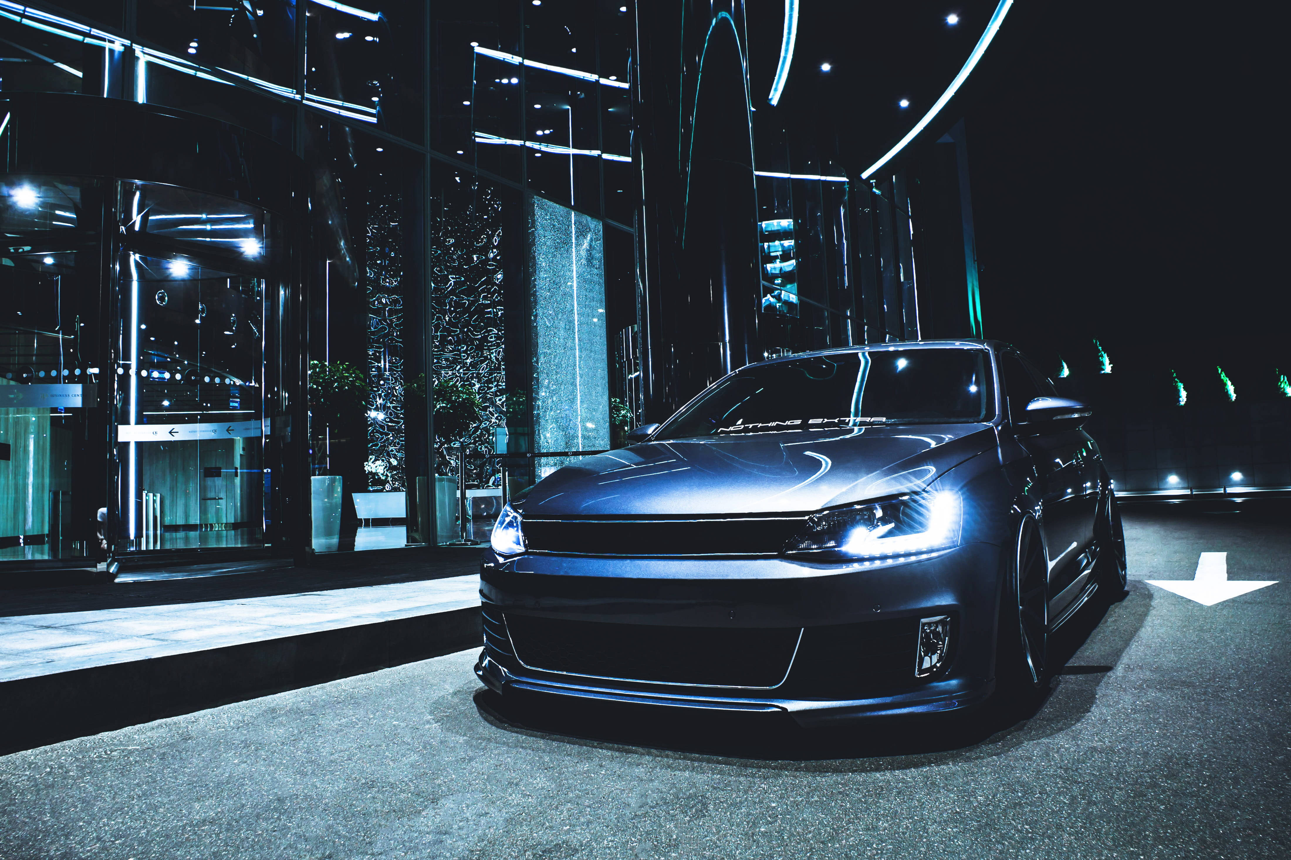 stunning black car, neon lights, modern glass building, 4K Desktop Wallpaper