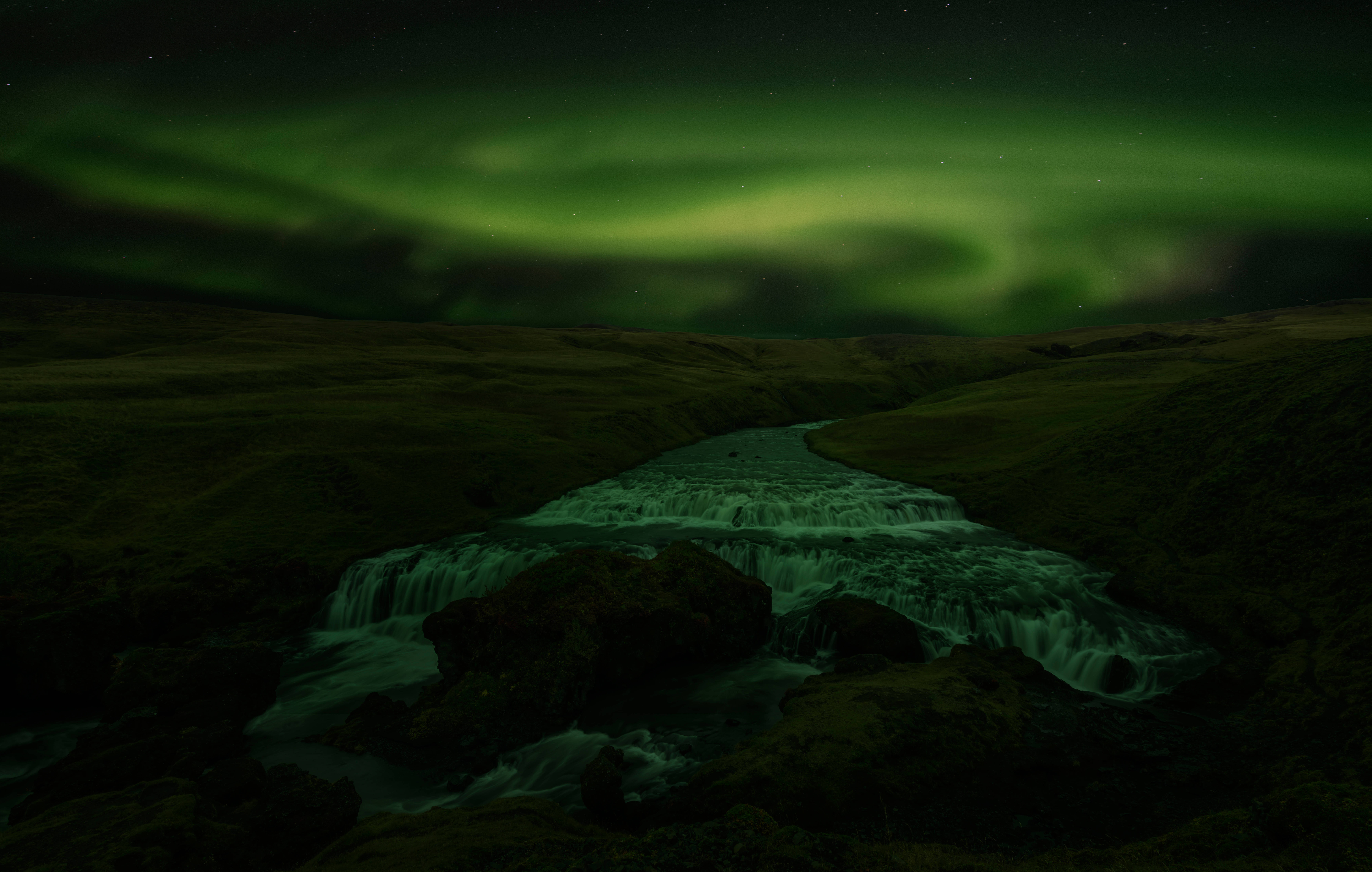 Green Aurora Borealis, cascading river, dark mossy valley, 8K Desktop Wallpaper