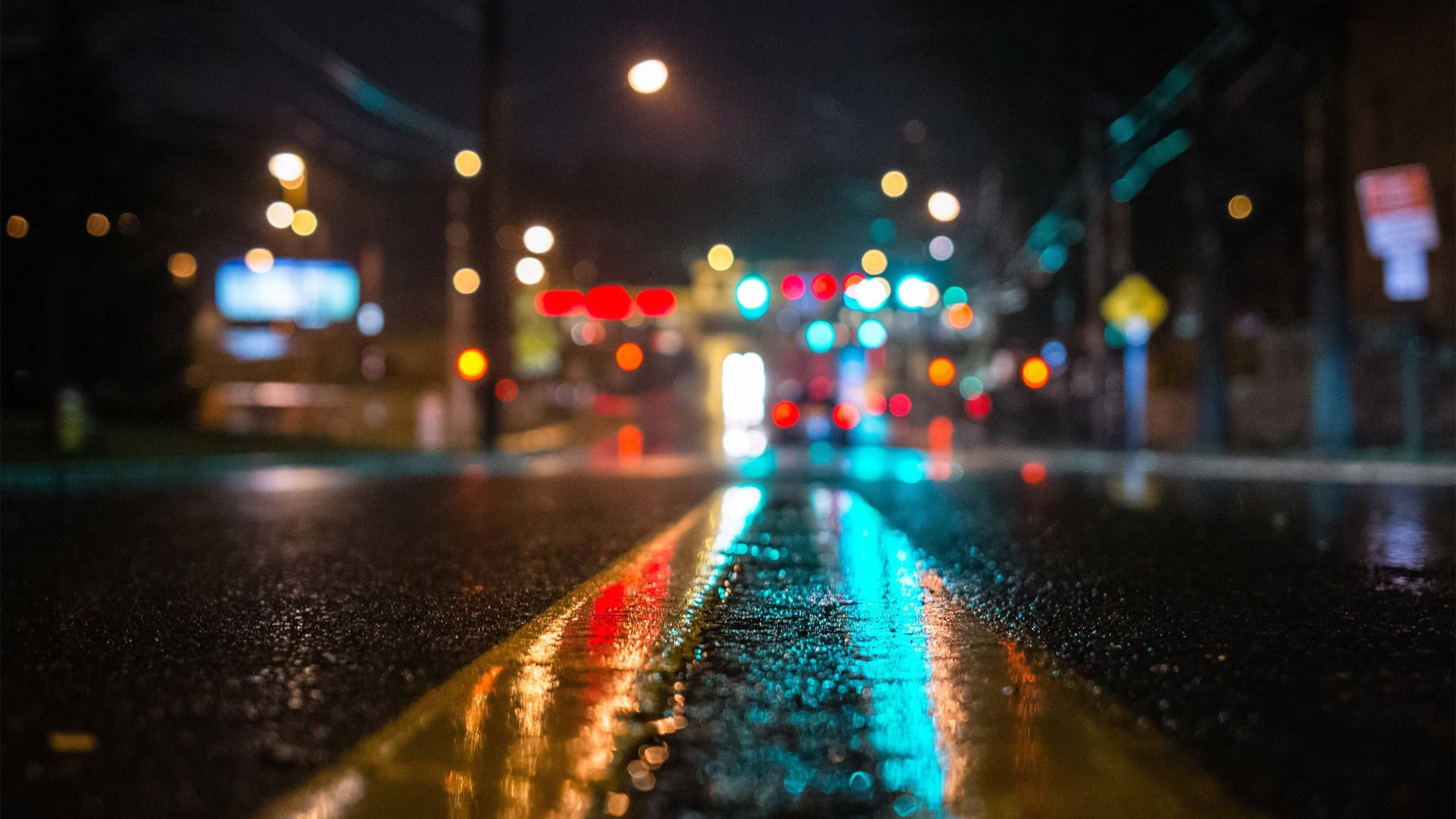 wet asphalt, glowing bokeh lights, yellow center line, 4K Desktop Wallpaper
