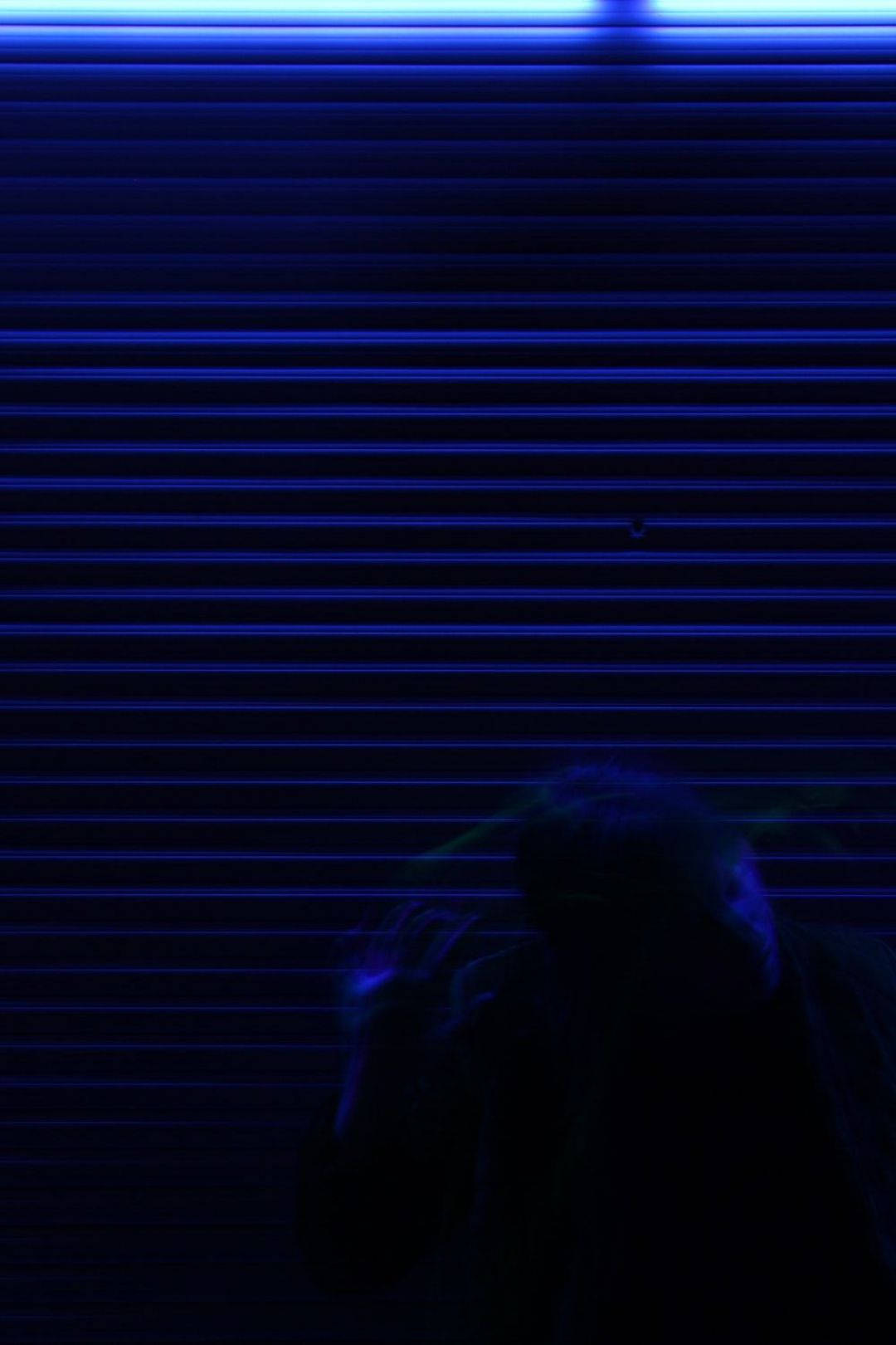 dark blue iPhone, blue-lit metal shutter, shadowy figure, HD Phone Wallpaper