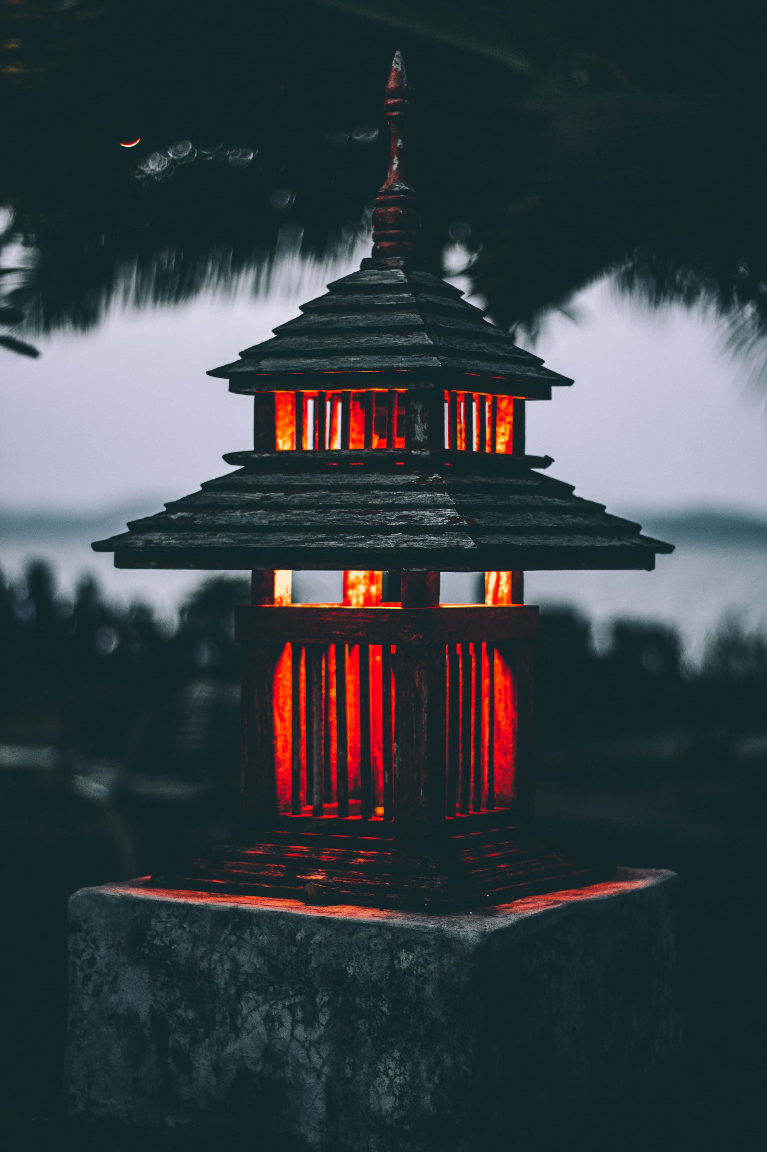 Japanese-Style Dark iPhone, traditional tiered wooden lantern, red light, 4K Phone Wallpaper