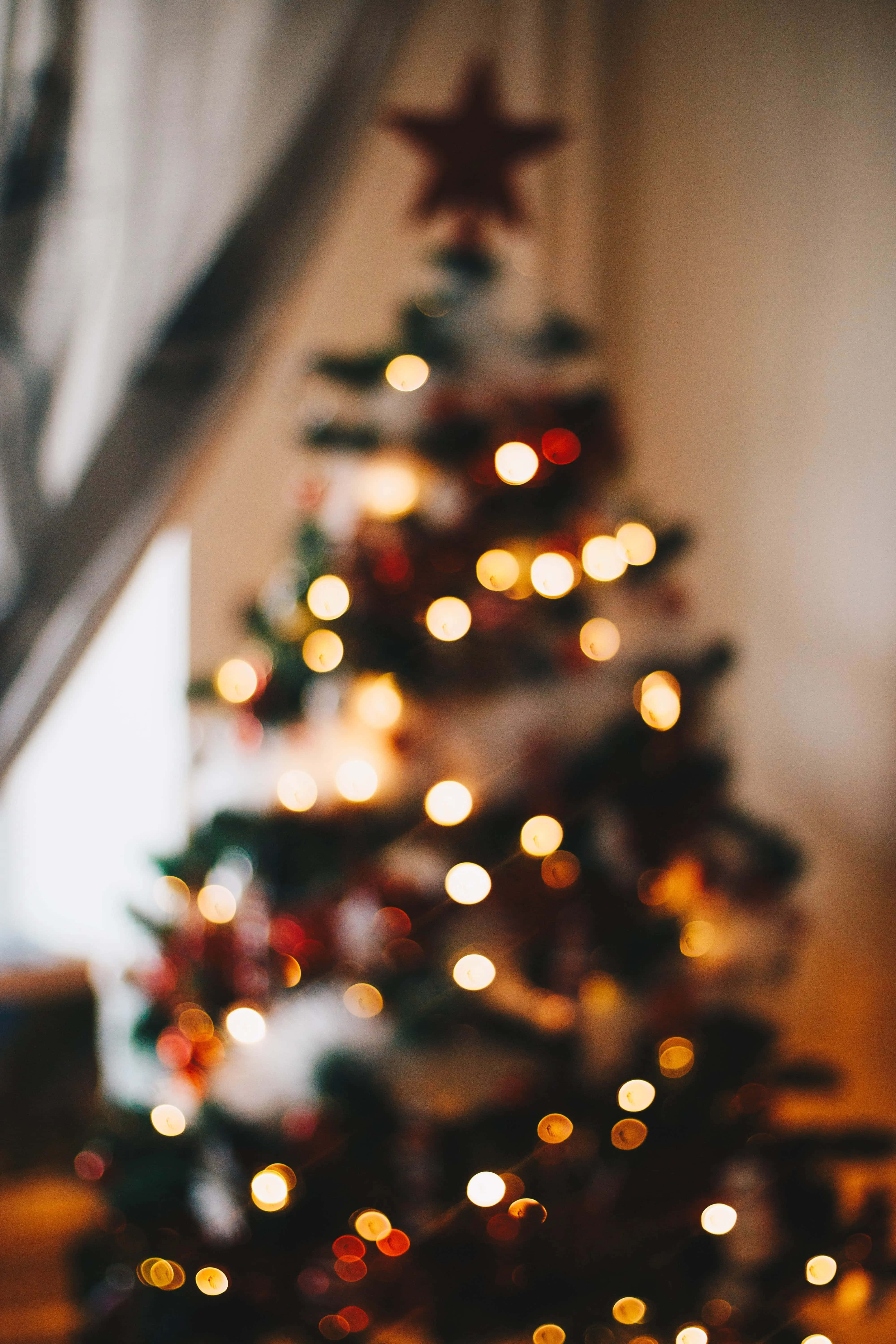 Christmas tree, twinkling warm lights, star topper, 5K Phone Wallpaper