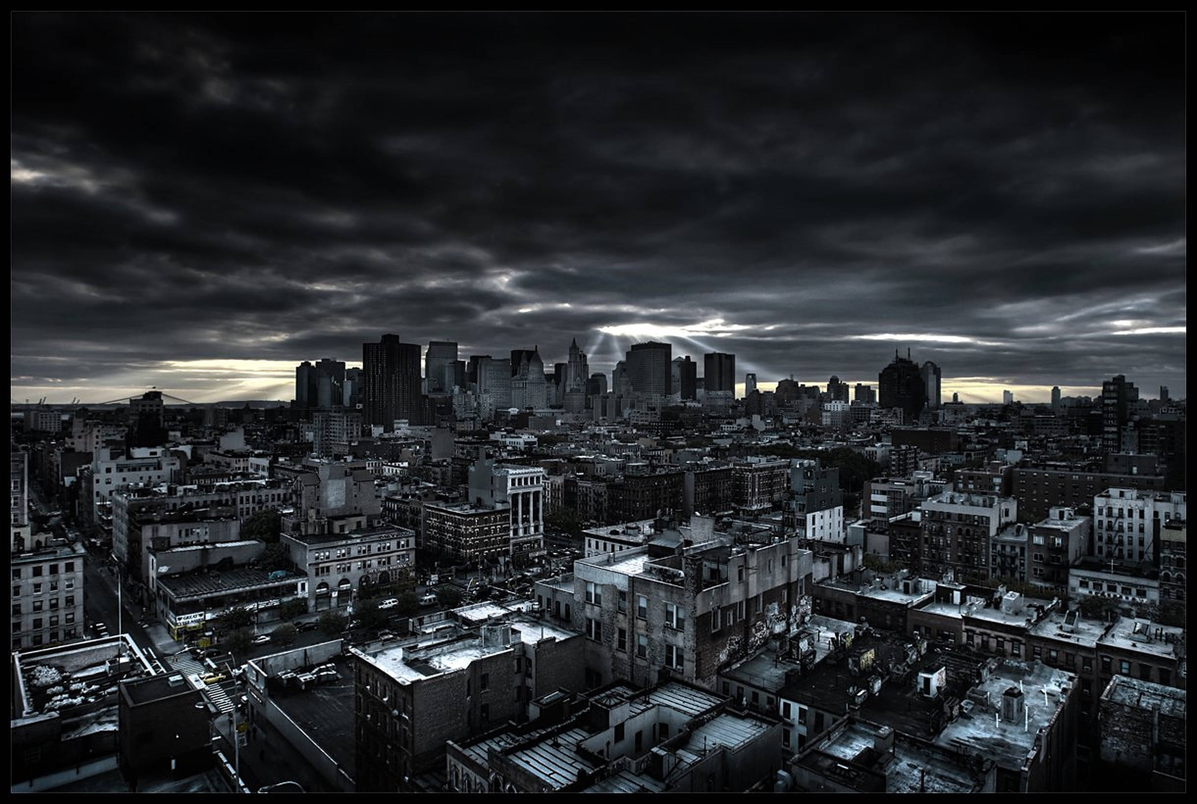 Dark city, stormy sky, dramatic rays of light, Full HD Desktop Wallpaper