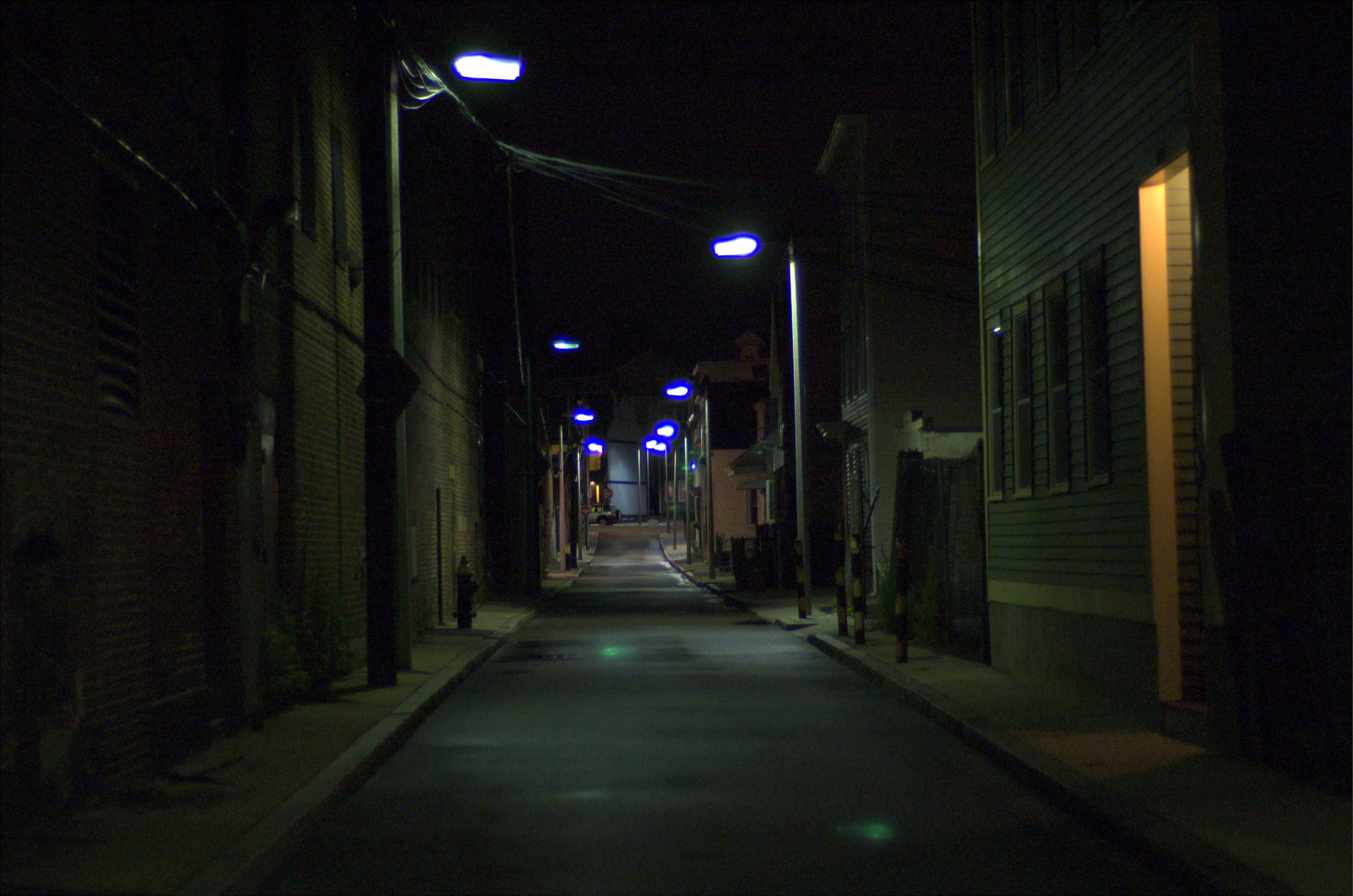 dark alleyway, night, glowing blue streetlights, 2K Desktop Wallpaper