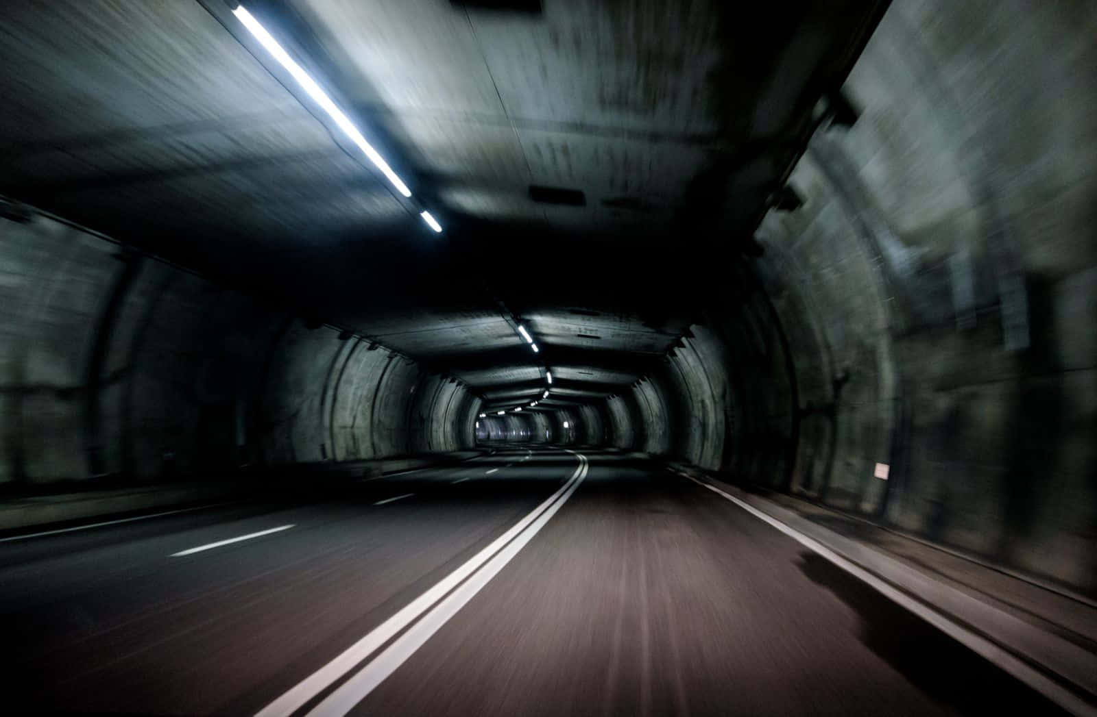 dark concrete tunnel, glowing overhead lights, motion blur, HD Desktop Wallpaper