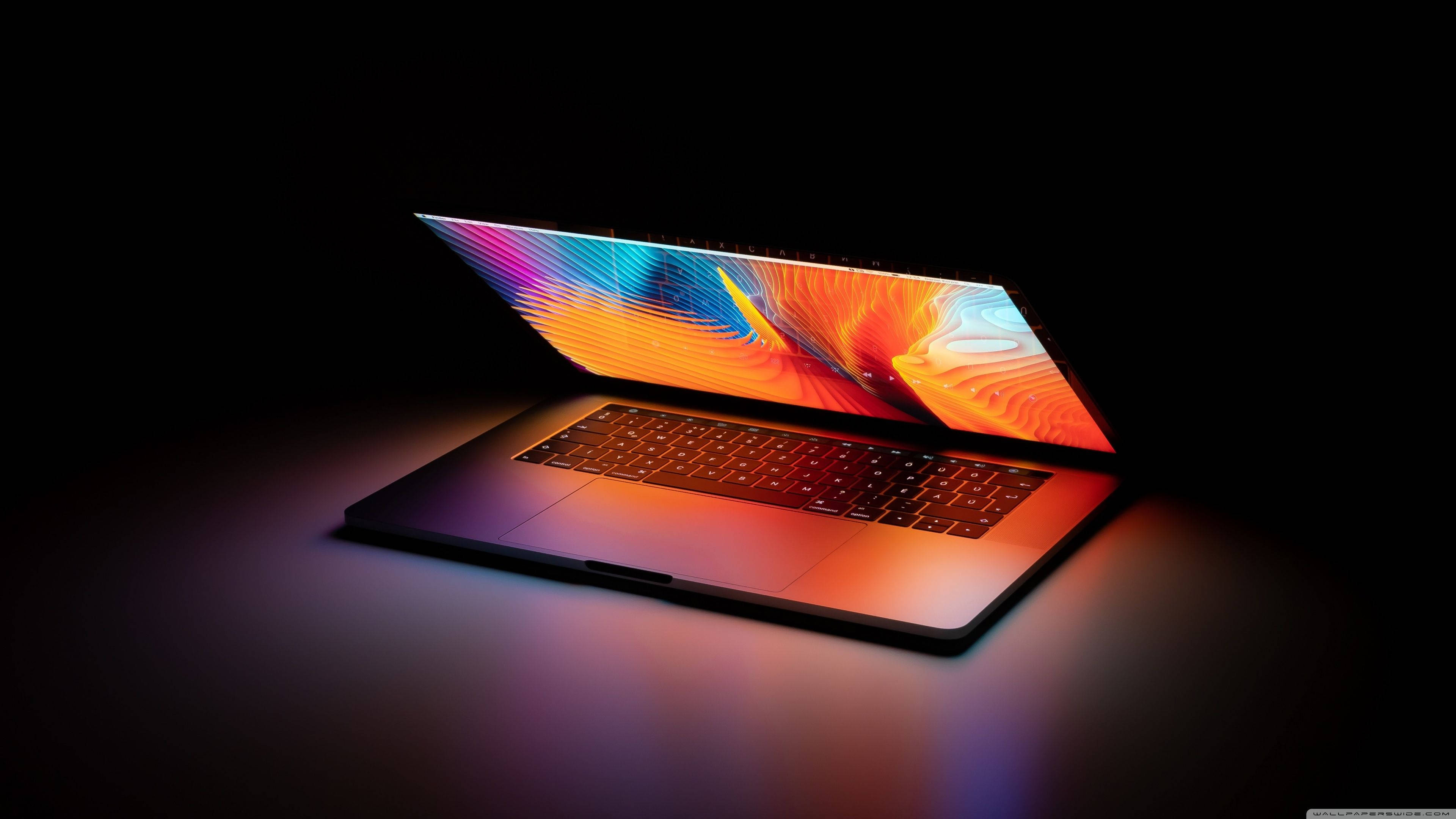 laptop, vibrant abstract colors, dark background, 4K Desktop Wallpaper