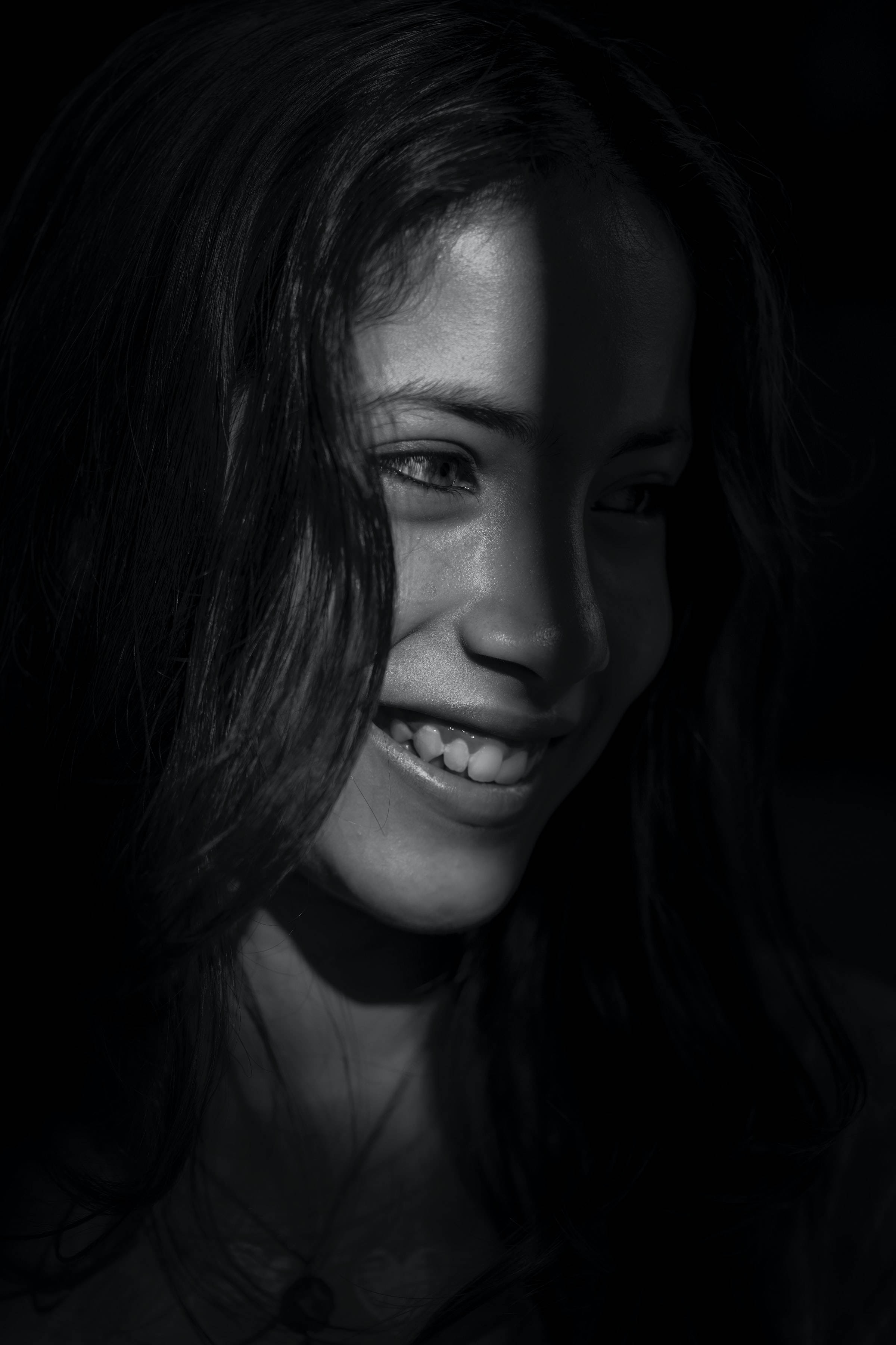 girl in the shadows, black and white portrait, chiaroscuro lighting, 2K Phone Wallpaper