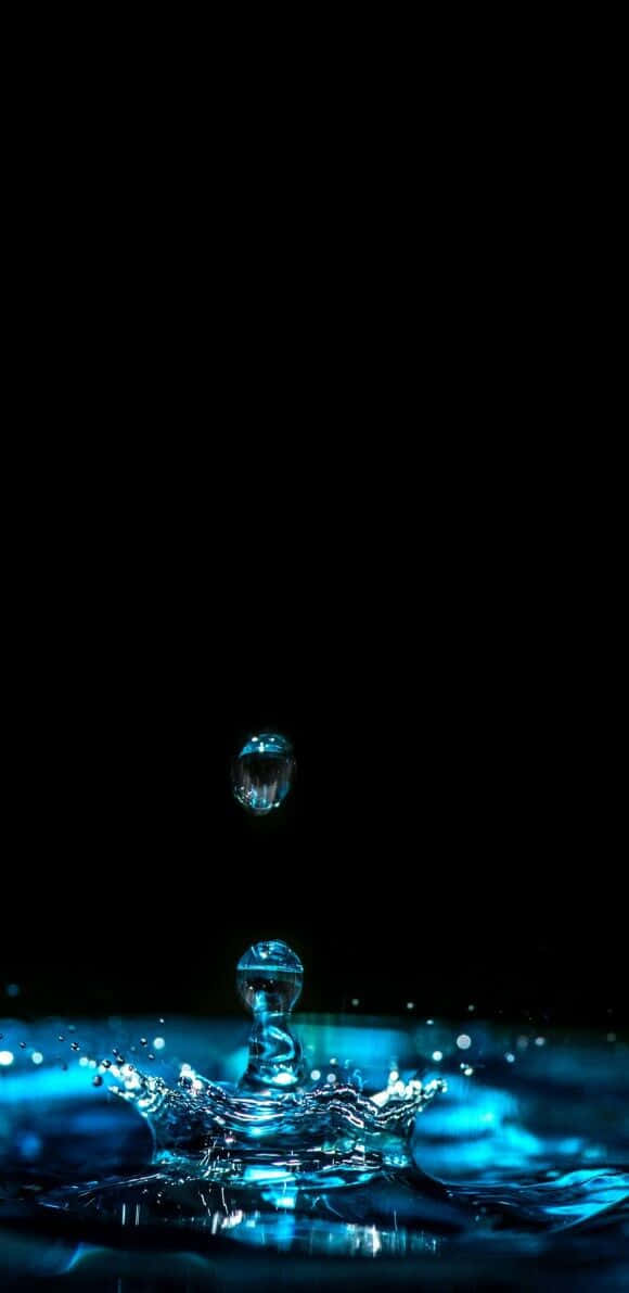 glowing blue water droplet, rippling pool, pitch black background, SD Phone Wallpaper