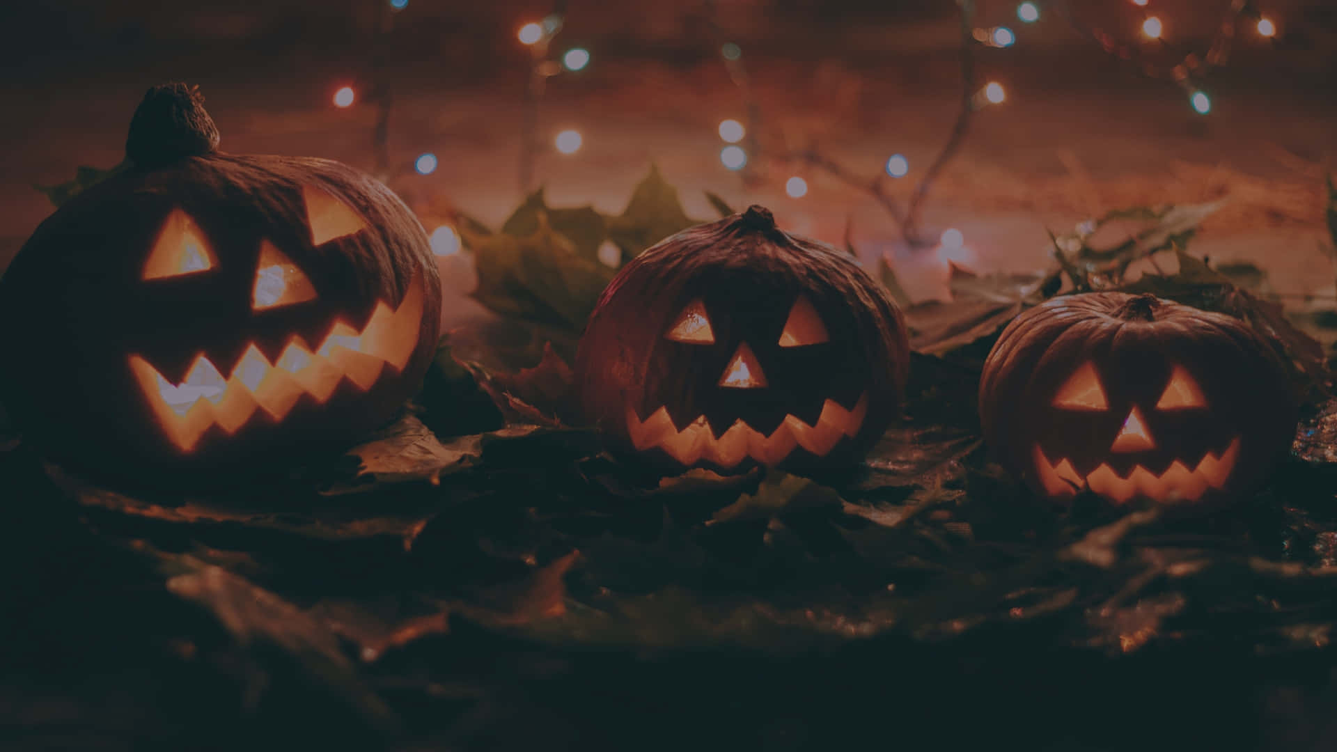glowing jack-o'-lanterns, carved grins, twinkling string lights, Full HD Desktop Wallpaper