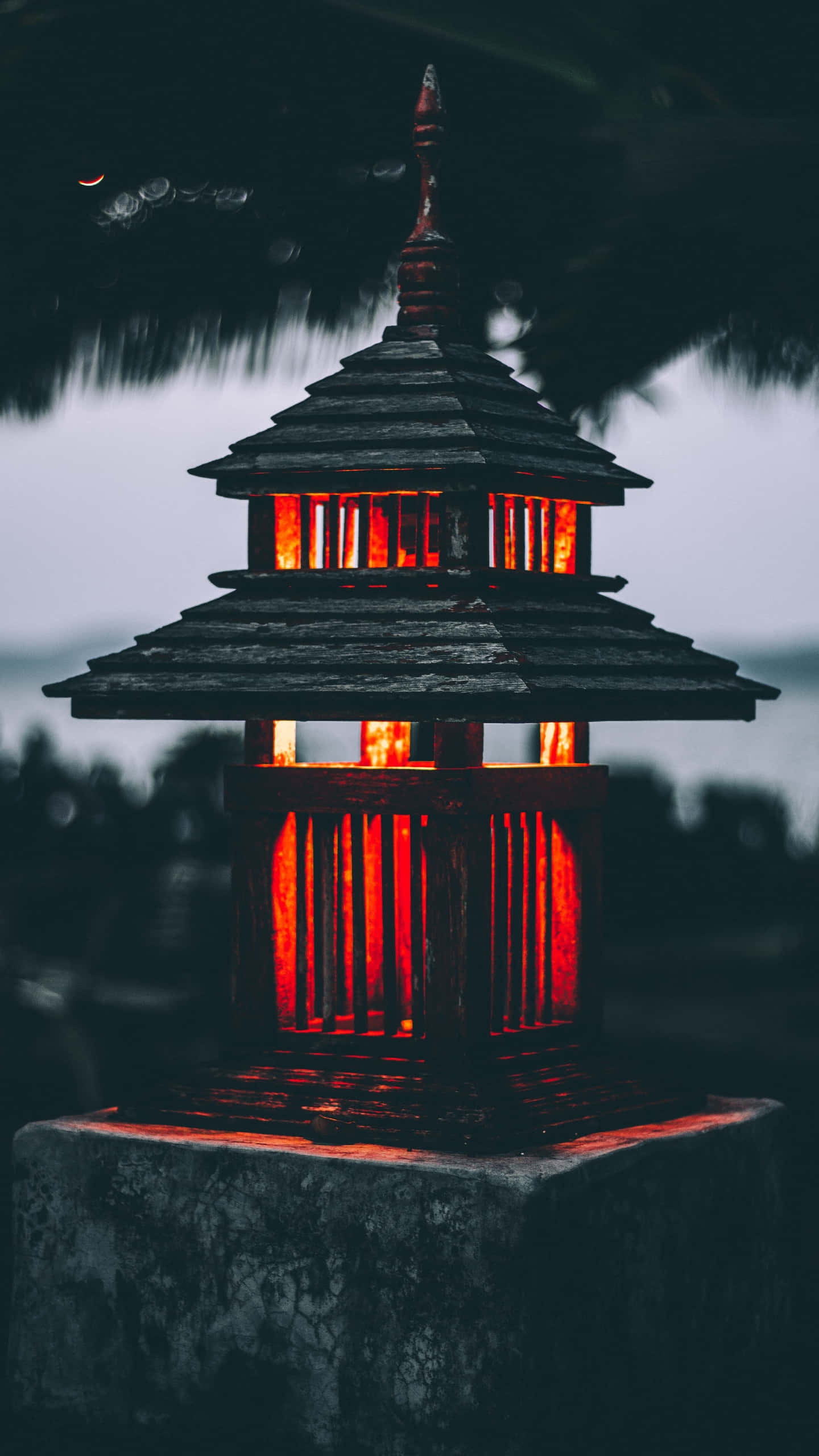 traditional wooden lantern, glowing red light, dark rainy night sky, 2K Phone Wallpaper