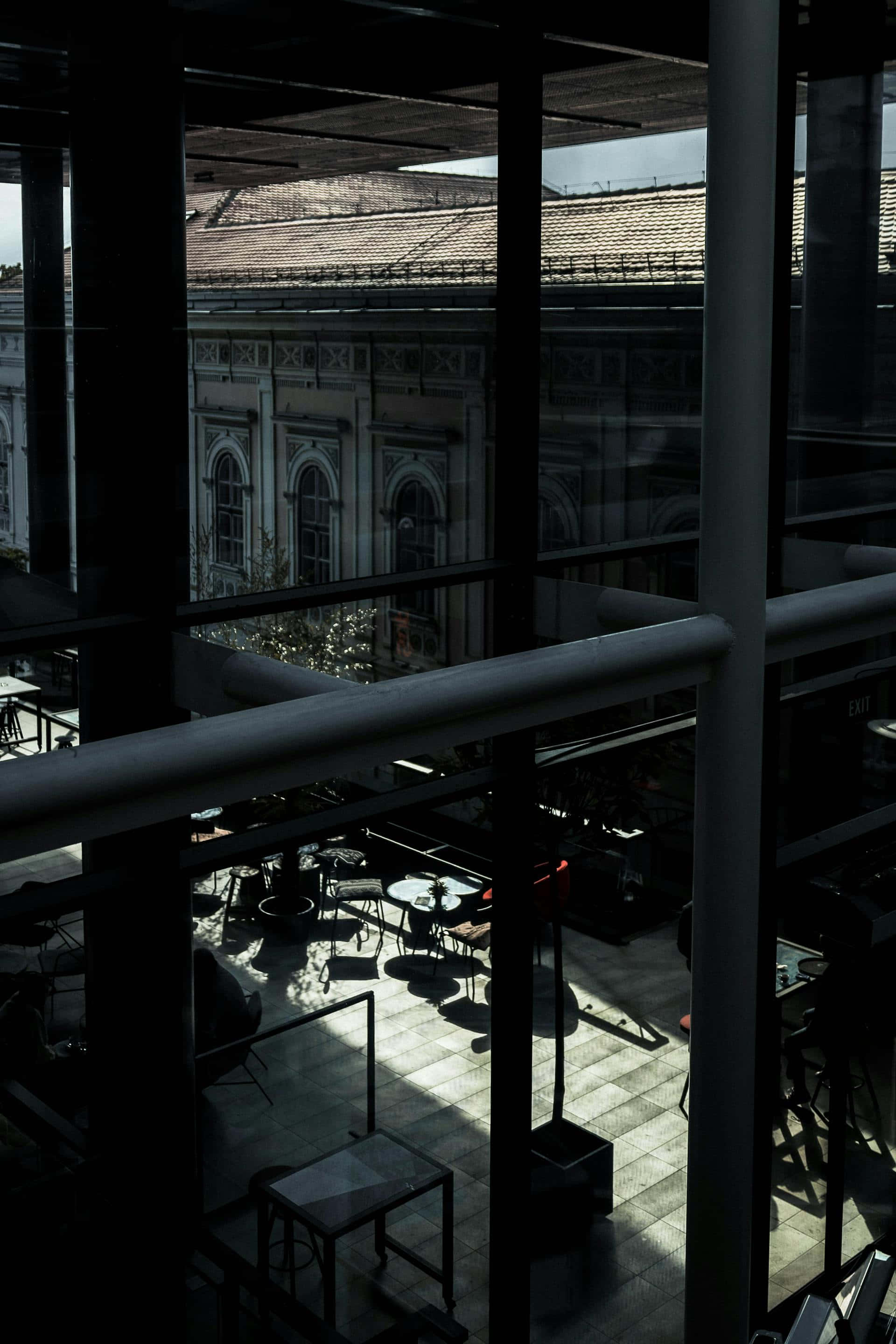 modern glass atrium, sunlight, sharp shadows, 2K Phone Wallpaper