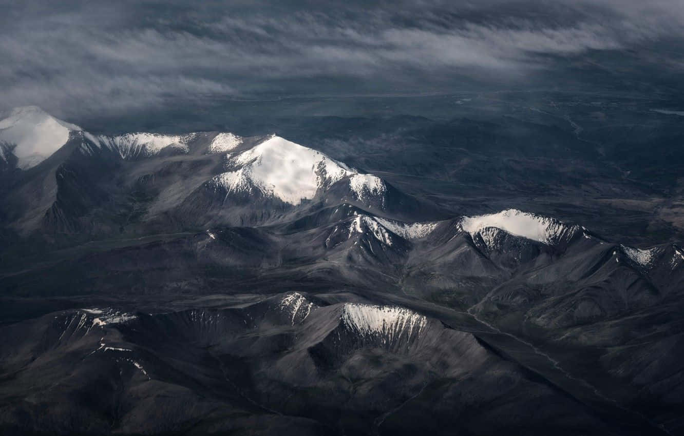 Dark Mountain, snow-capped mountain peaks, dramatic cloudy sky, HD Desktop Wallpaper