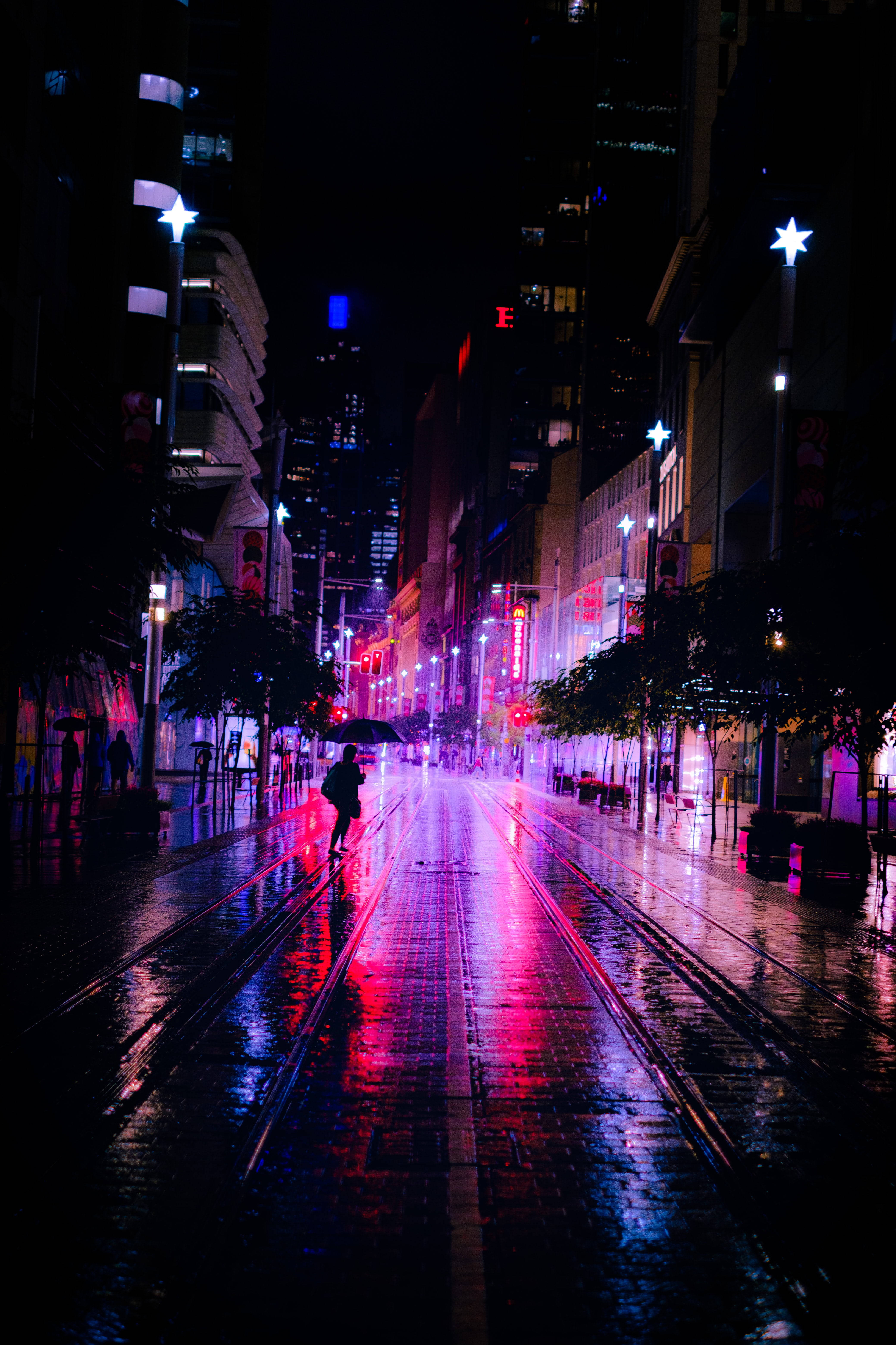 Dark Neon, neon-lit city street, rain-slicked, 5K Phone Wallpaper