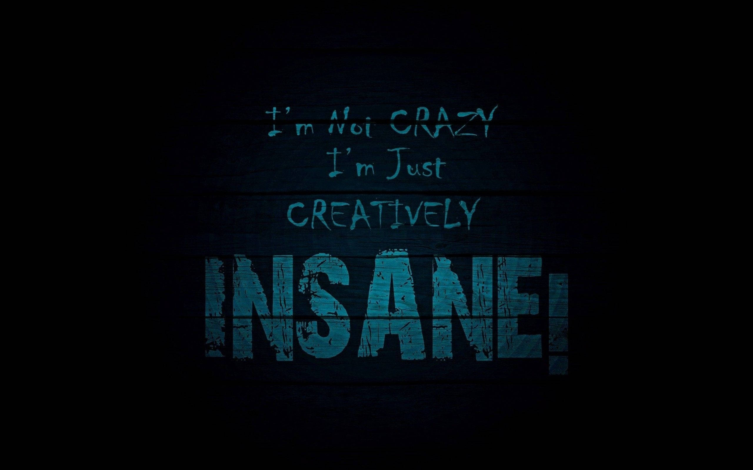 Creatively Insane Dark Quote, bold blue text, dark wooden wall, 2K Desktop Wallpaper