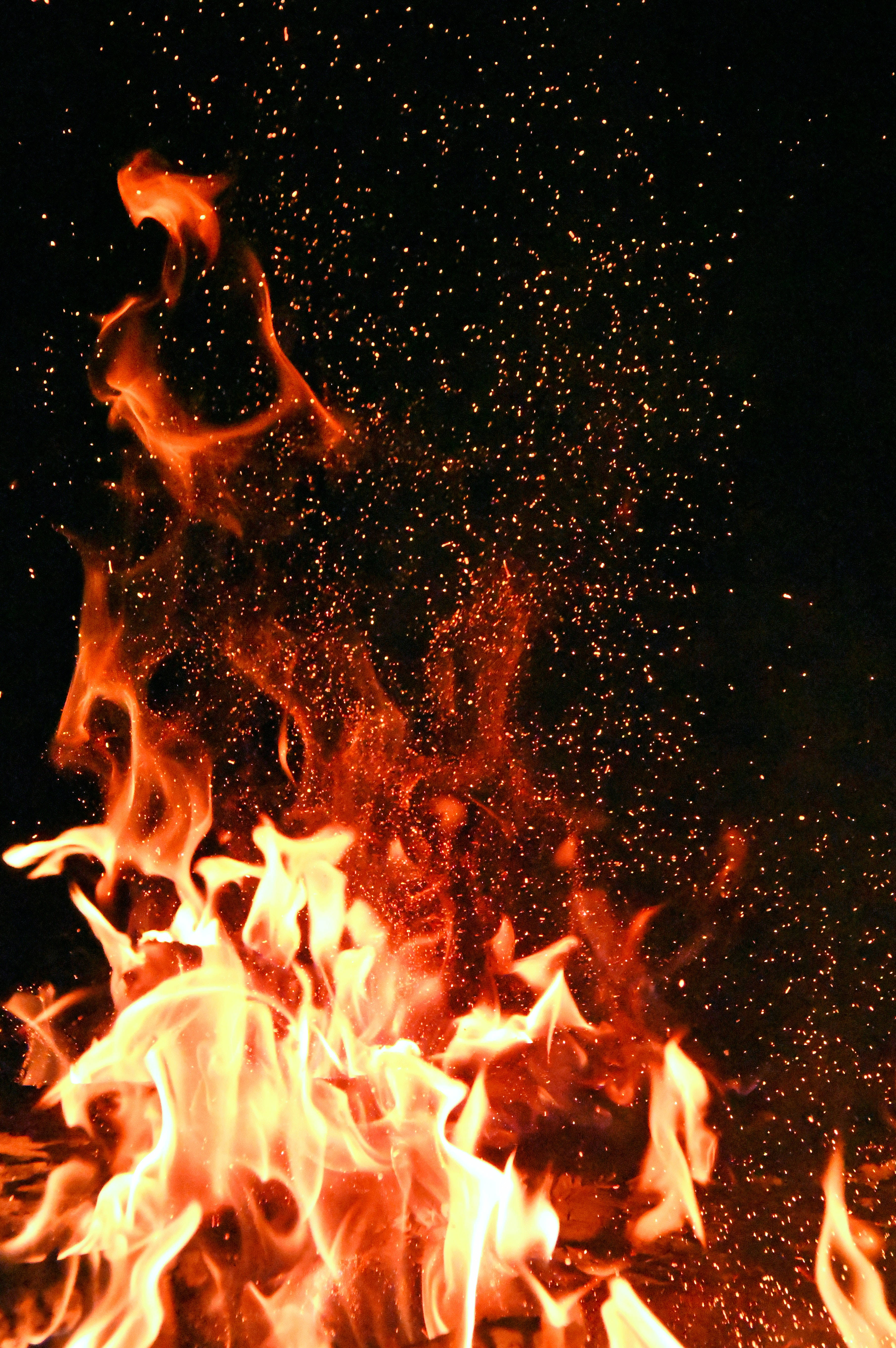 Dark Red Fire, vivid orange and yellow flames, pitch black background, 5K Phone Wallpaper