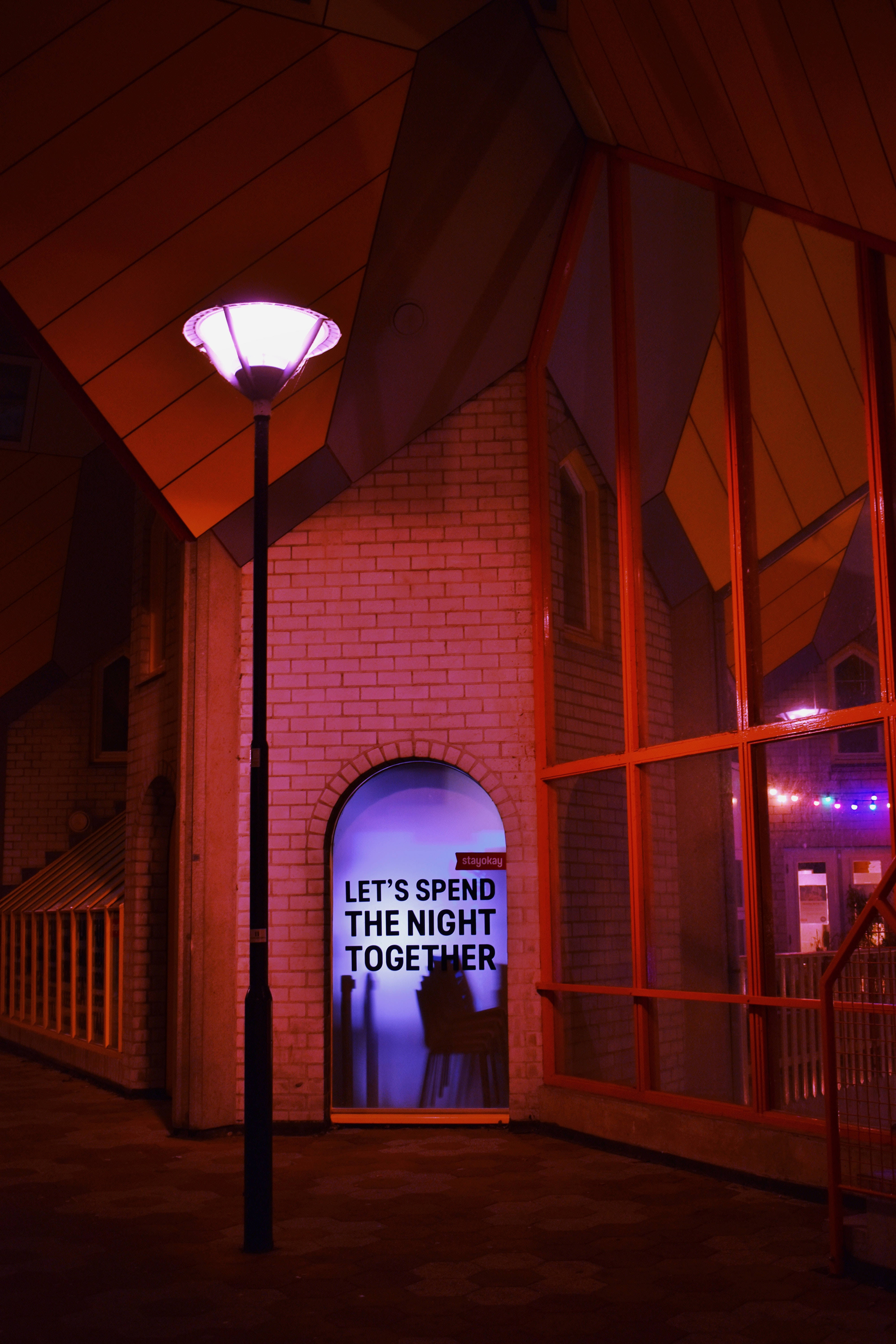 Dark Red, neon-lit urban alley, glowing pink streetlamp, 5K Phone Wallpaper