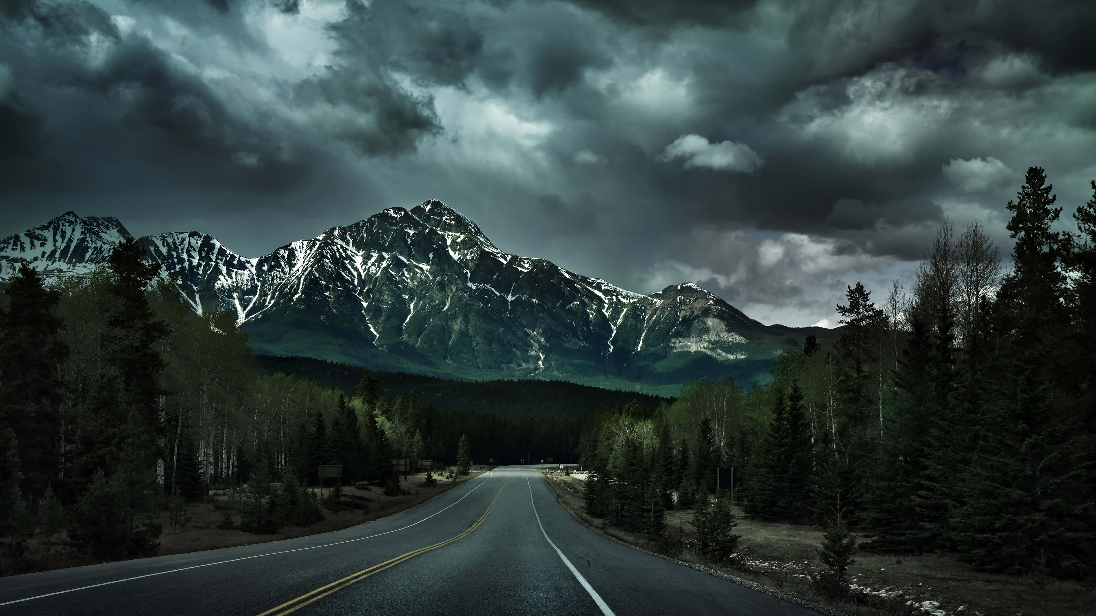 winding road, snow-capped mountains, brooding stormy sky, 4K Desktop Wallpaper