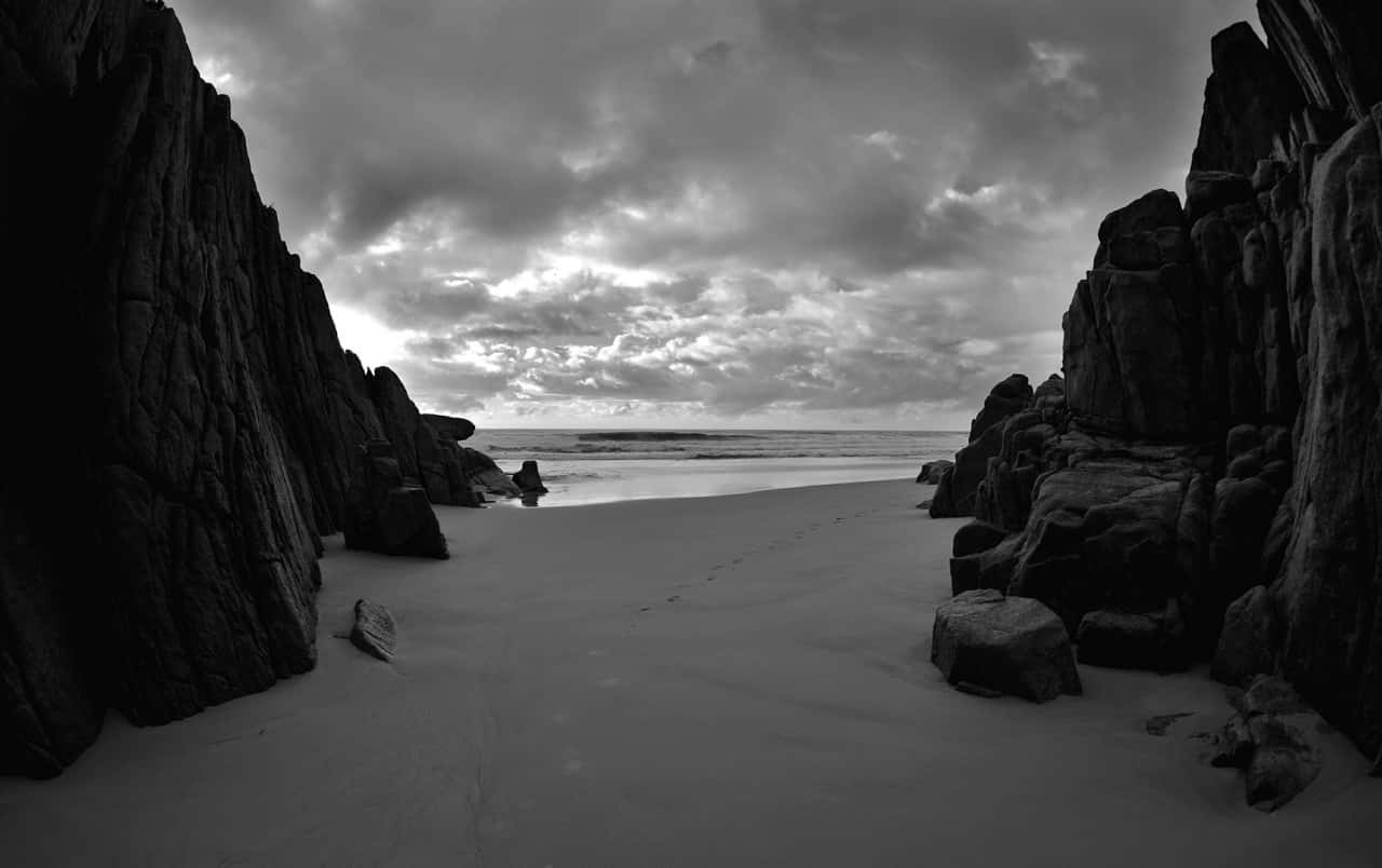 Dark Rock, narrow sandy cove, towering rugged cliffs, HD Desktop Wallpaper