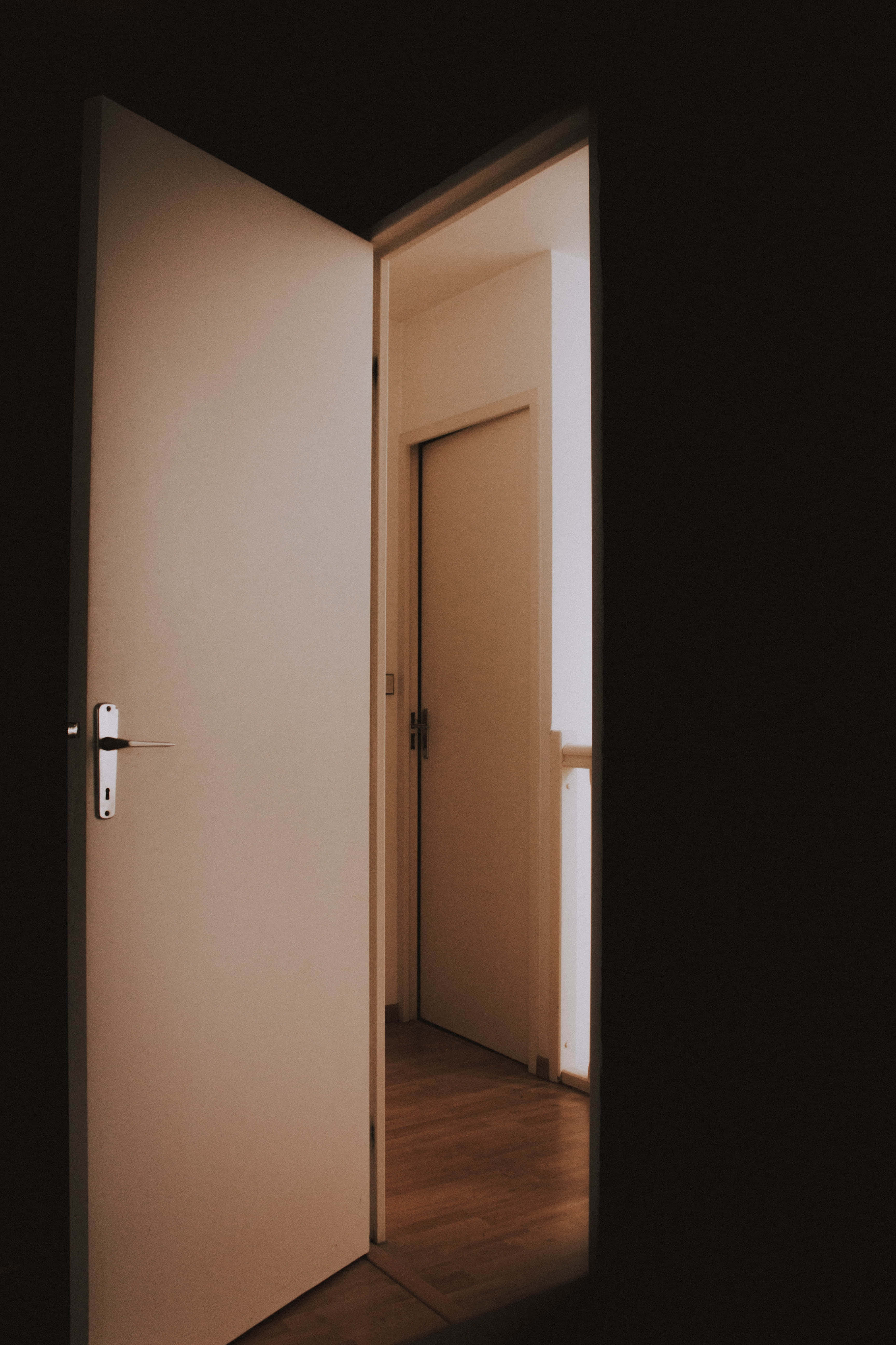 dark room, door ajar, warmly lit hallway, 5K Phone Wallpaper