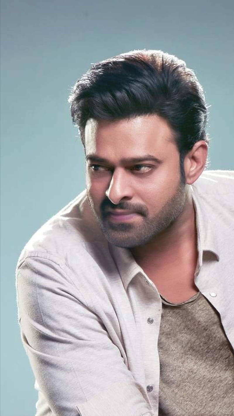 Darling Prabhas Movie, light shirt, muted blue background, HD Phone Wallpaper