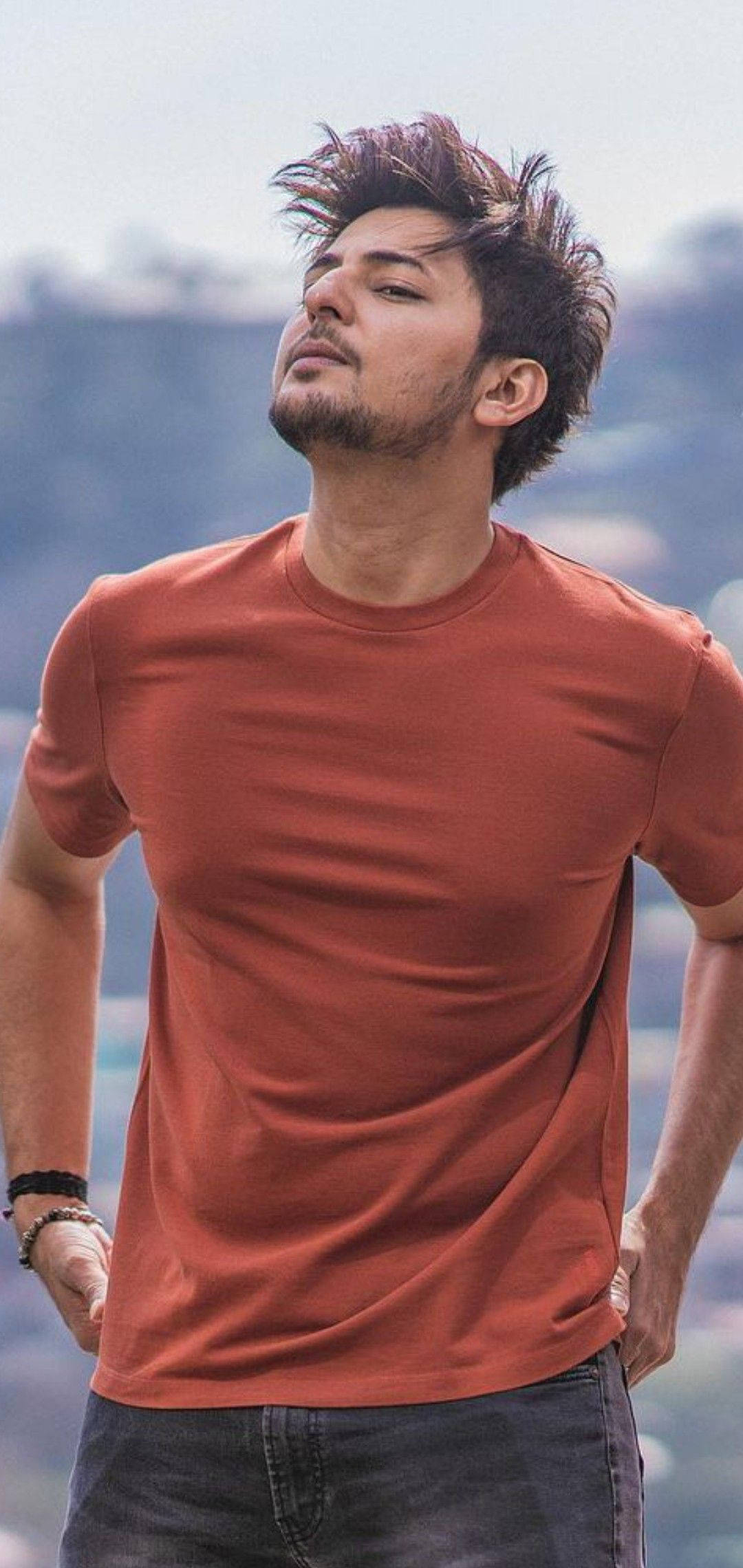 Darshan Raval, rust-colored t-shirt, hazy mountain backdrop, Full HD Phone Wallpaper