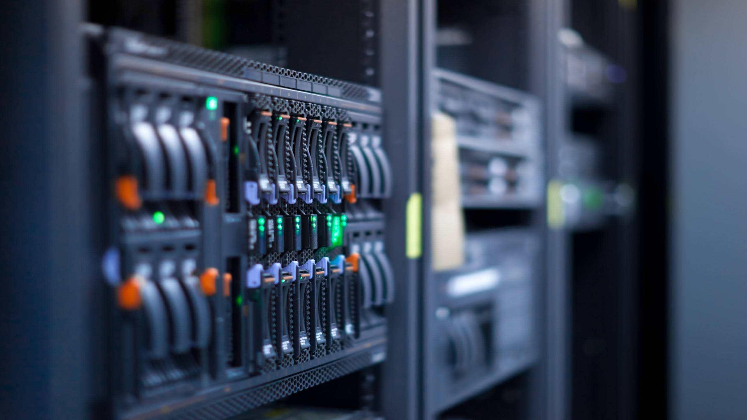 Data Center, server racks, blinking green and orange indicator lights, 2K Desktop Wallpaper
