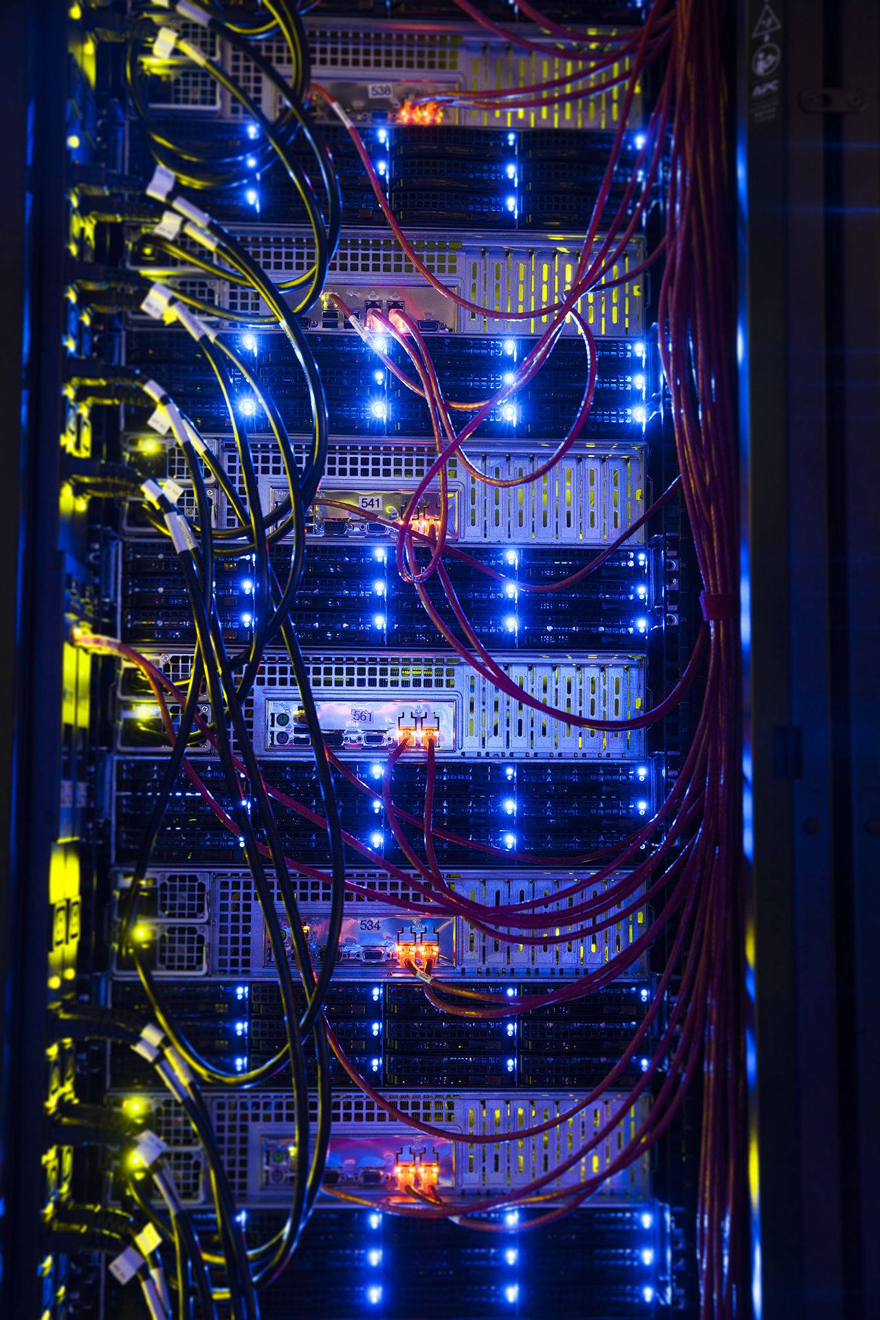 server rack, glowing blue and orange indicator lights, tangled red yellow and black cables, Full HD Phone Wallpaper