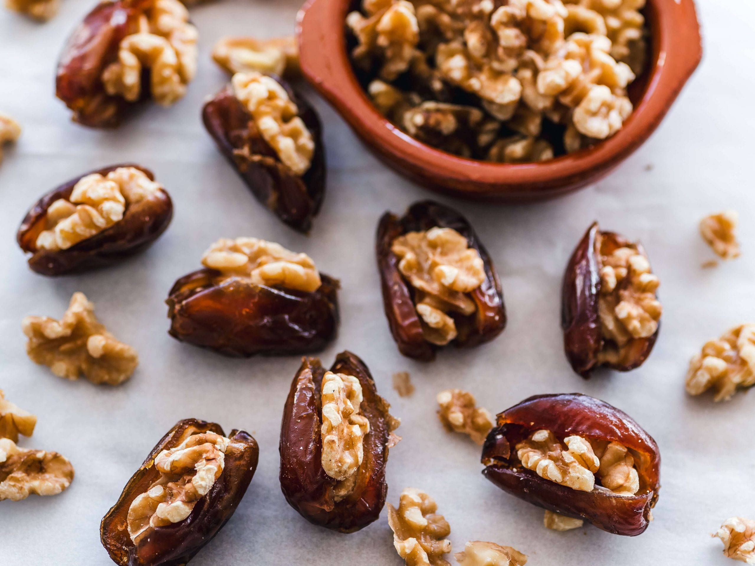 dried dates, walnut fillings, parchment paper, 2K Desktop Wallpaper