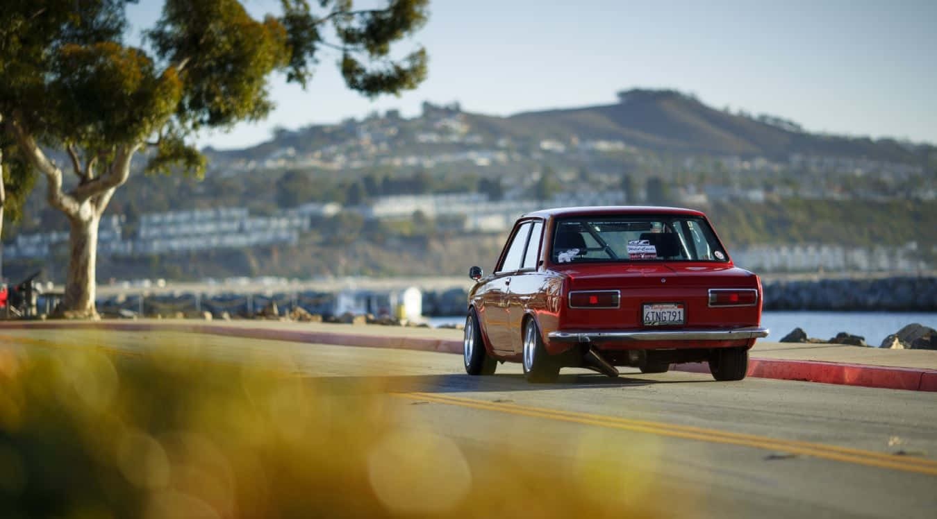 Datsun 510, red car, coastal road, HD Desktop Wallpaper