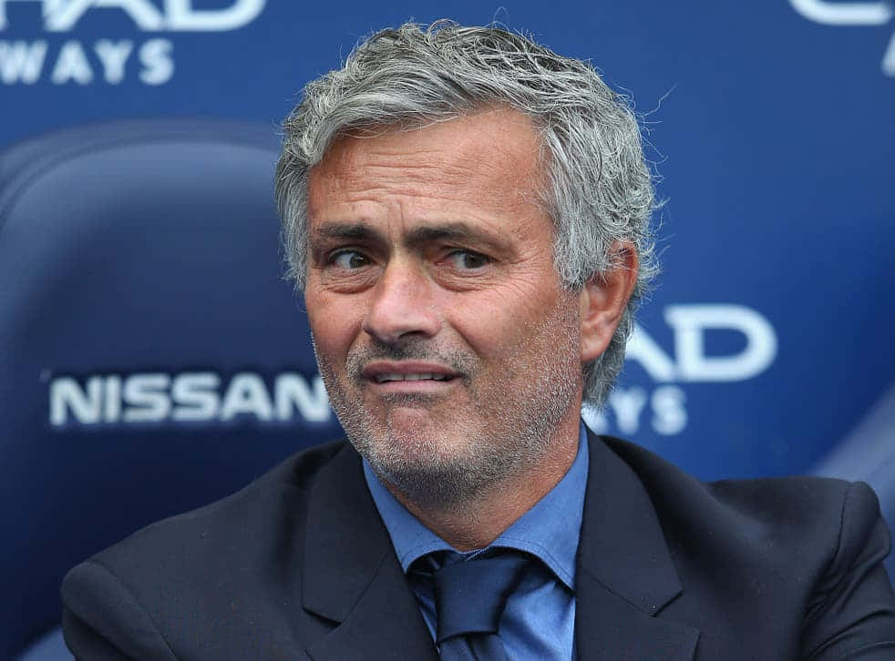 David Ginola, blue branded backdrop, dark suit, SD Desktop Wallpaper