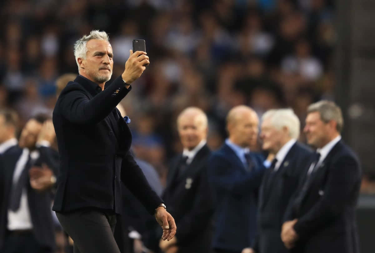 David Ginola, dark suit, smartphone, SD Desktop Wallpaper