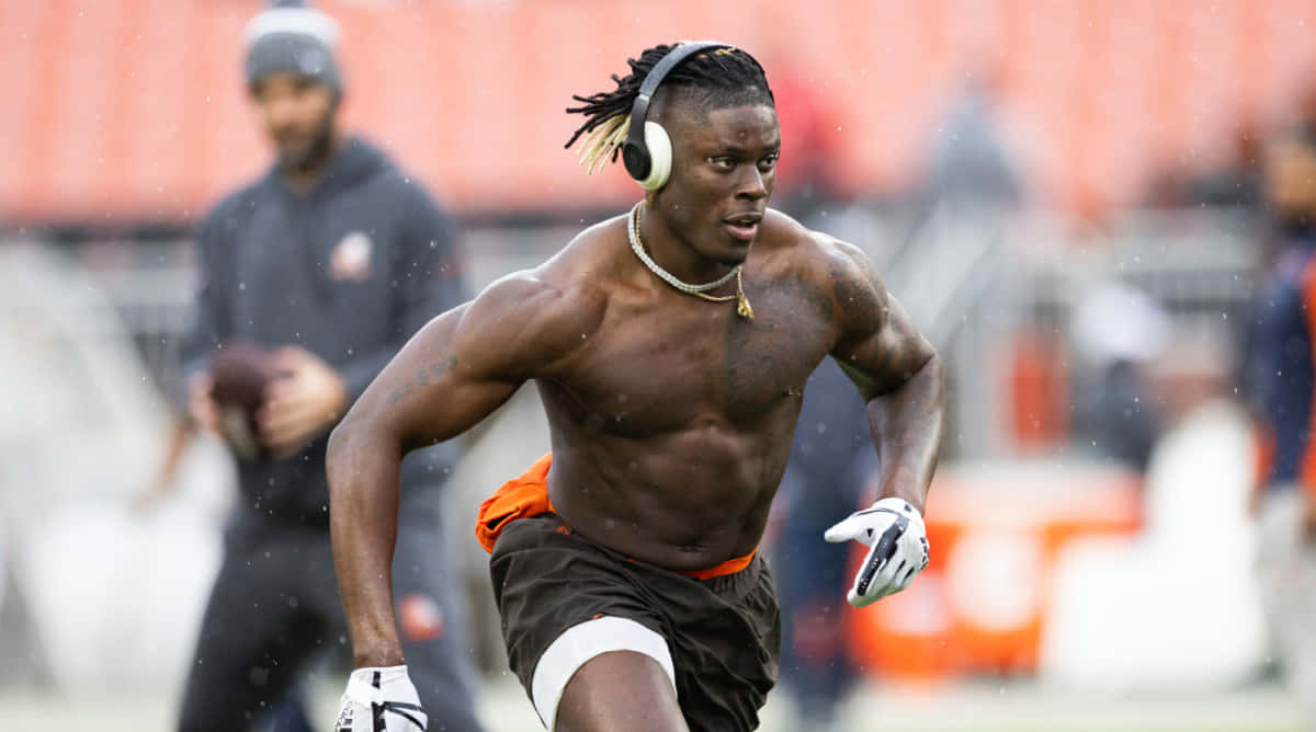 David Njoku, rainy field, shirtless, SD Desktop Wallpaper