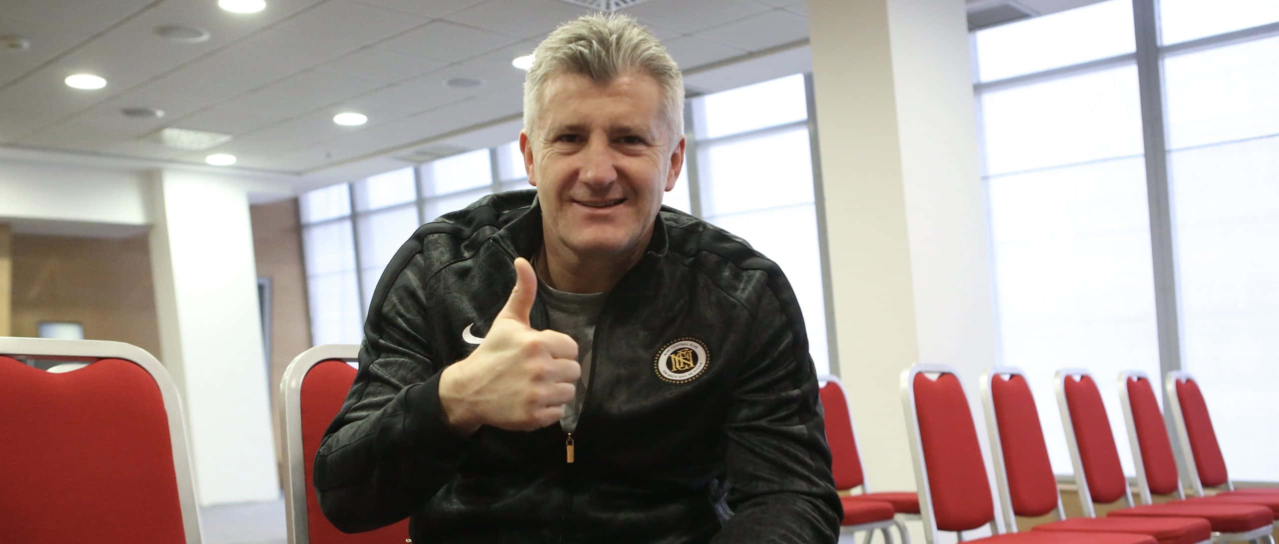 Davor Suker, black jacket, red chairs, 2K Desktop Wallpaper