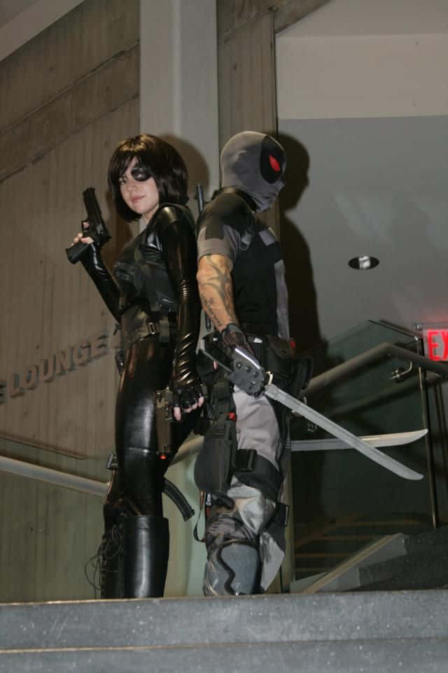Deadpool and Domino, black and grey superhero costumes, staircase, SD Phone Wallpaper