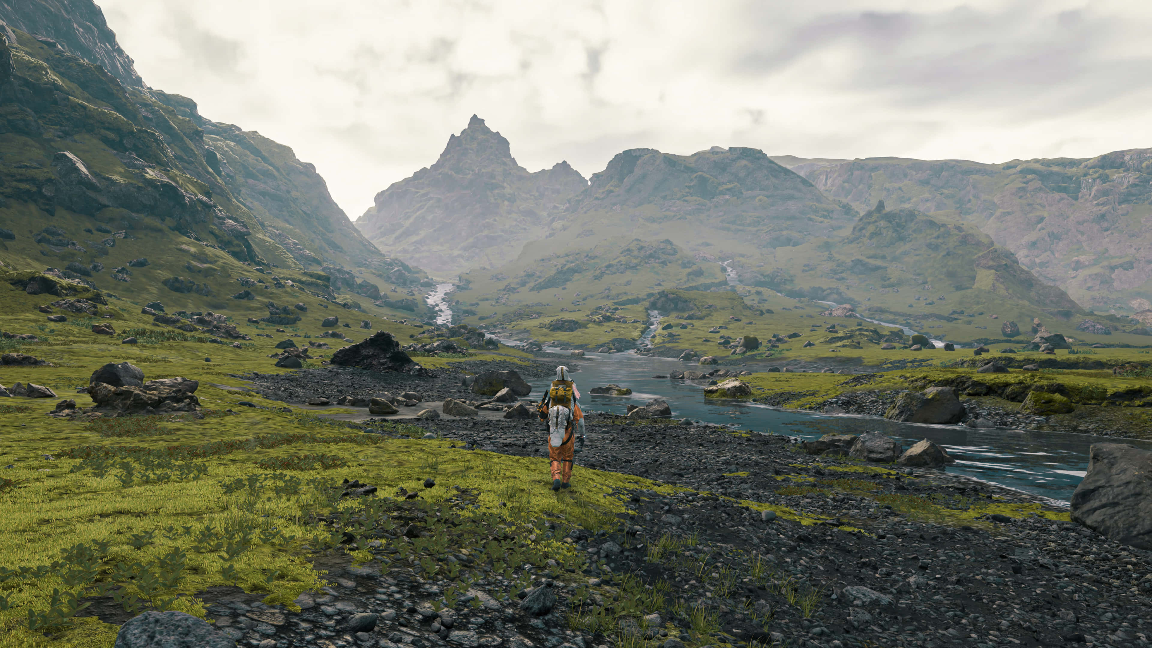 Death Stranding, rocky riverbank, vast green valley, 4K Desktop Wallpaper