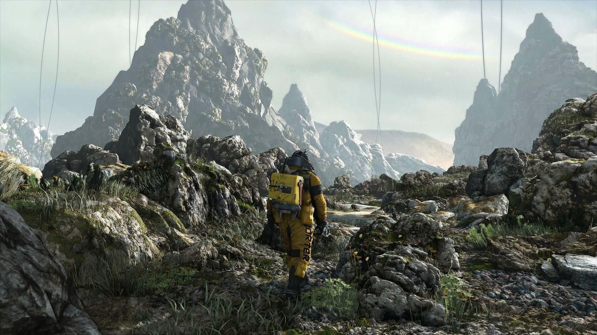 Death Stranding HD, yellow suit, rocky mountainous terrain, Full HD Desktop Wallpaper