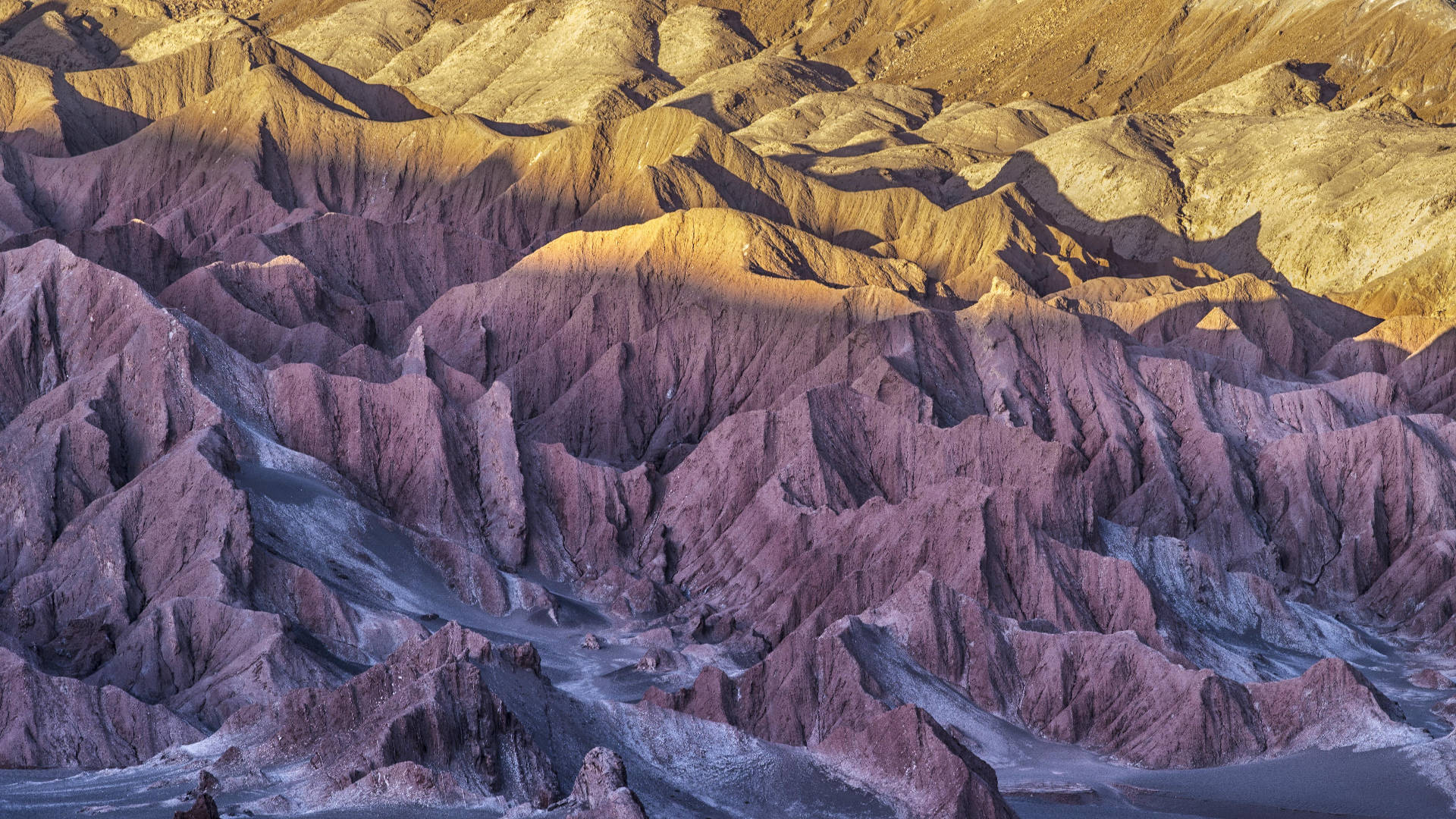 Death Valley, jagged purple and gold rock formations, dramatic desert canyon, Full HD Desktop Wallpaper