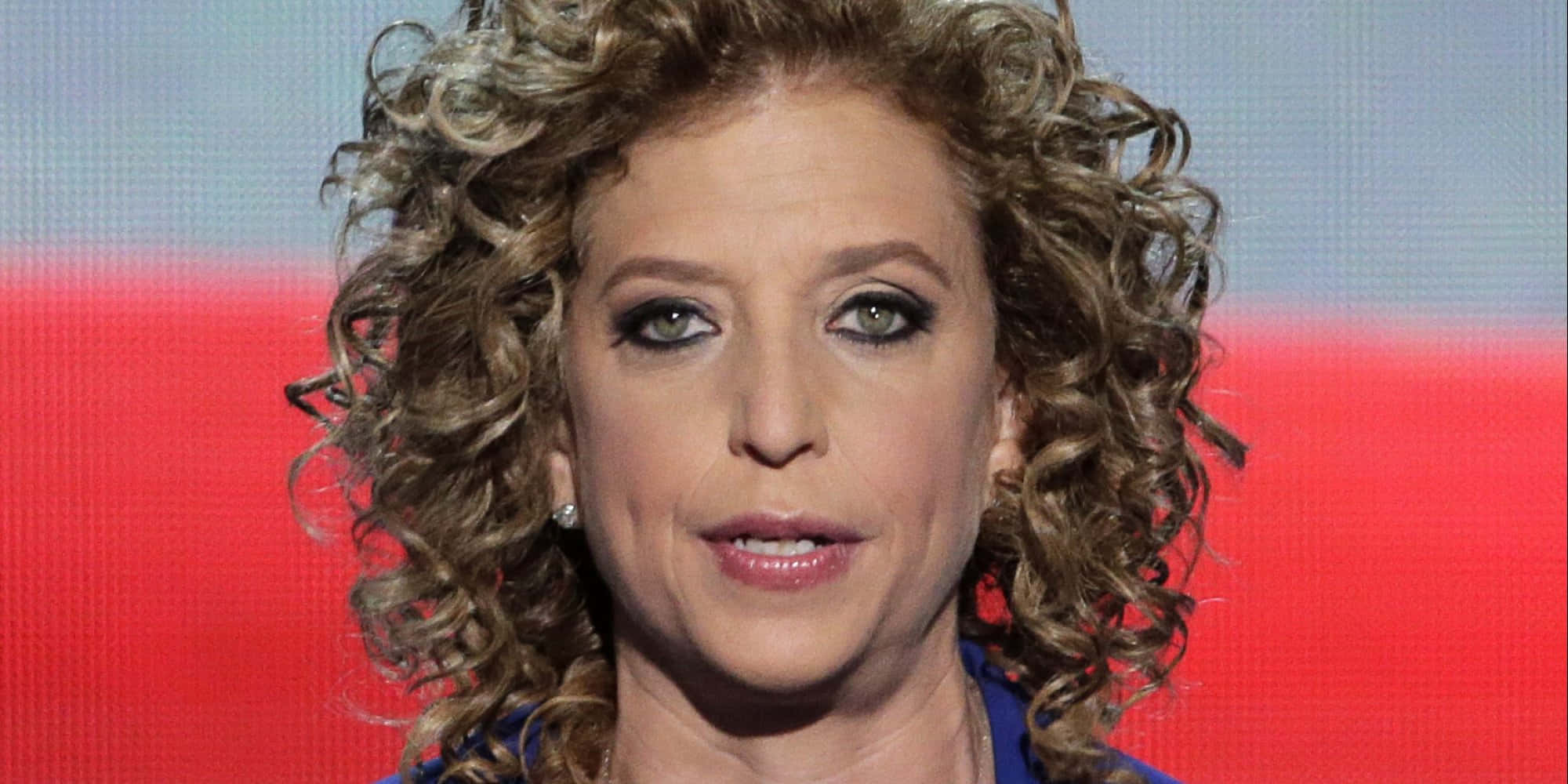 Debbie Wasserman Schultz, red and blue gradient background, voluminous curly hair, Full HD Desktop Wallpaper