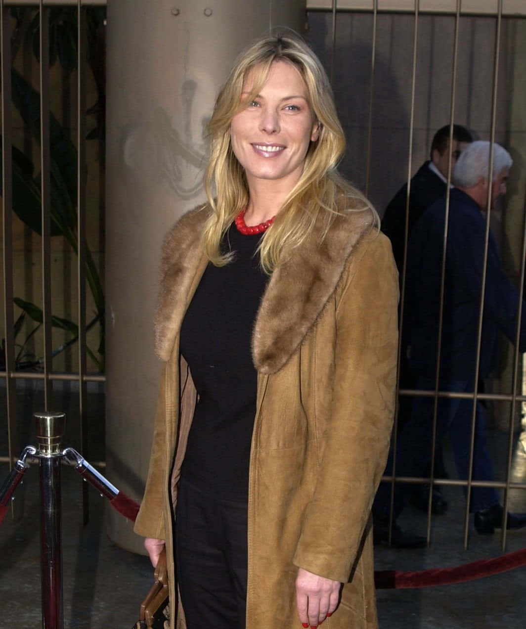Deborah Kara Unger, tan fur-trimmed coat, red necklace, SD Phone Wallpaper
