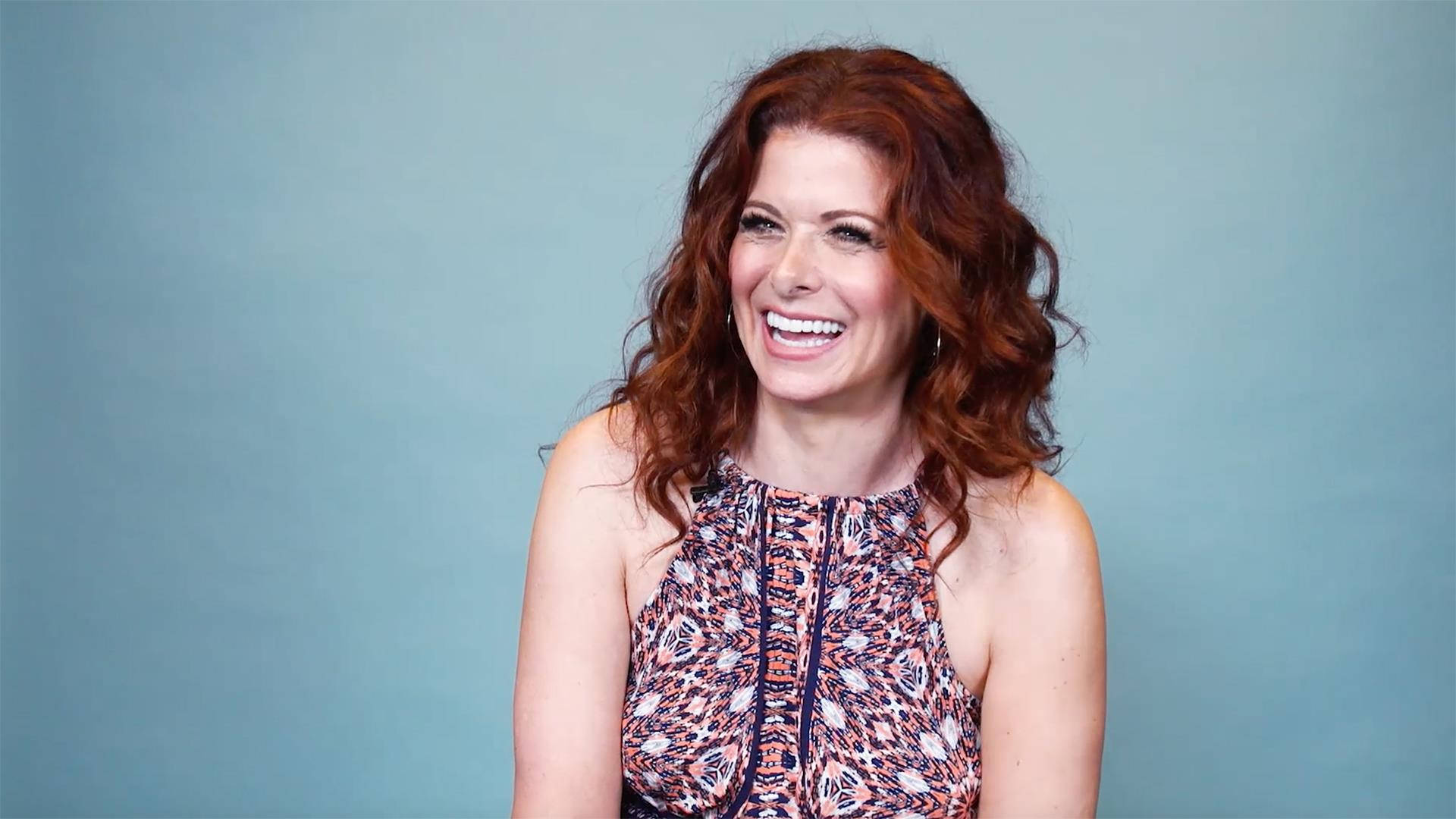 Debra Messing, vibrant red hair, solid blue studio backdrop, Full HD Desktop Wallpaper